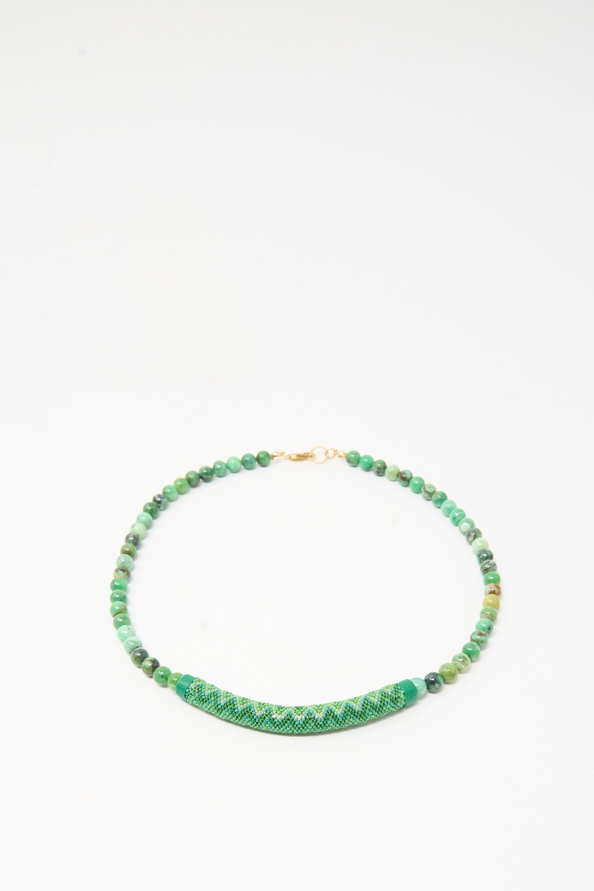 Robin Mollicone Beaded Bar Necklace in Chrysoprase, featuring green mottled beads and a curved, woven green bar segment at the center.