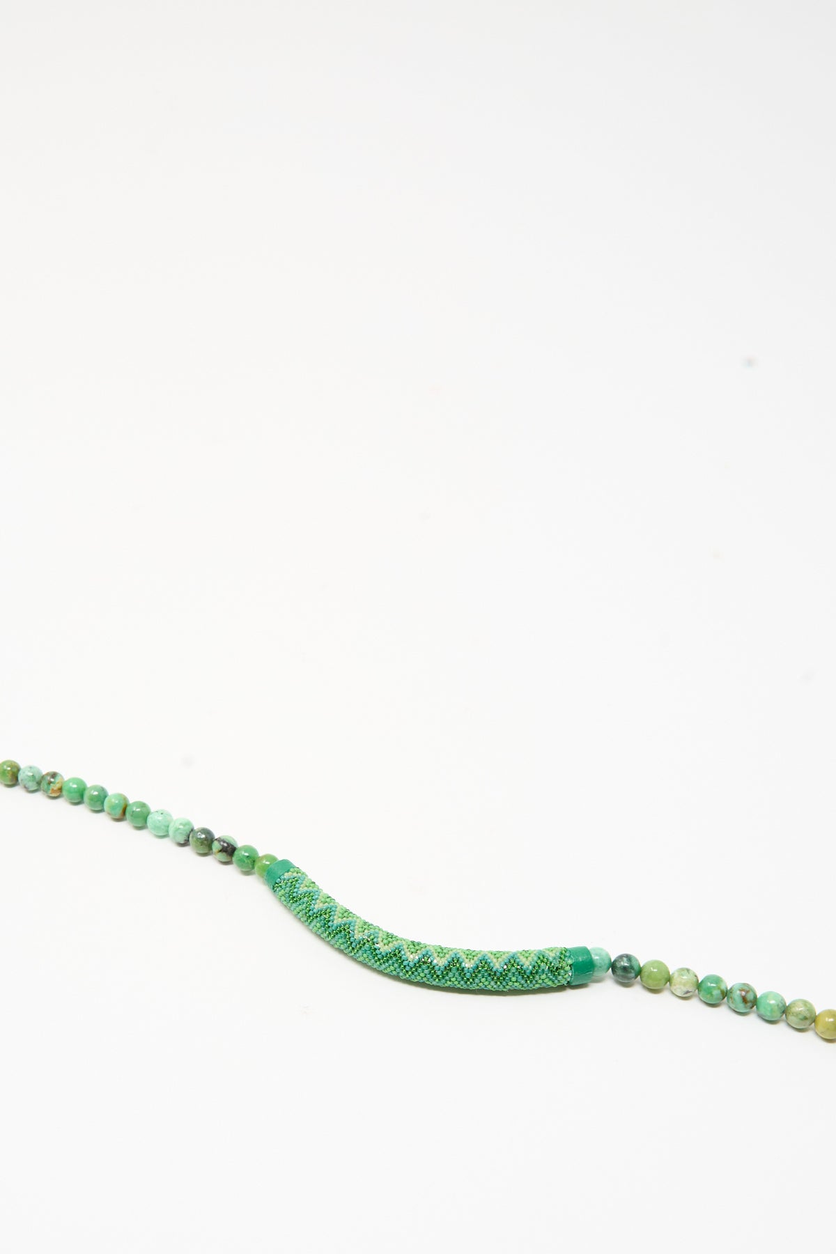Robin Mollicone Beaded Bar Necklace in Chrysoprase featuring a central curved bar of green woven seed beads flanked by strands of Chrysoprase stone beads.