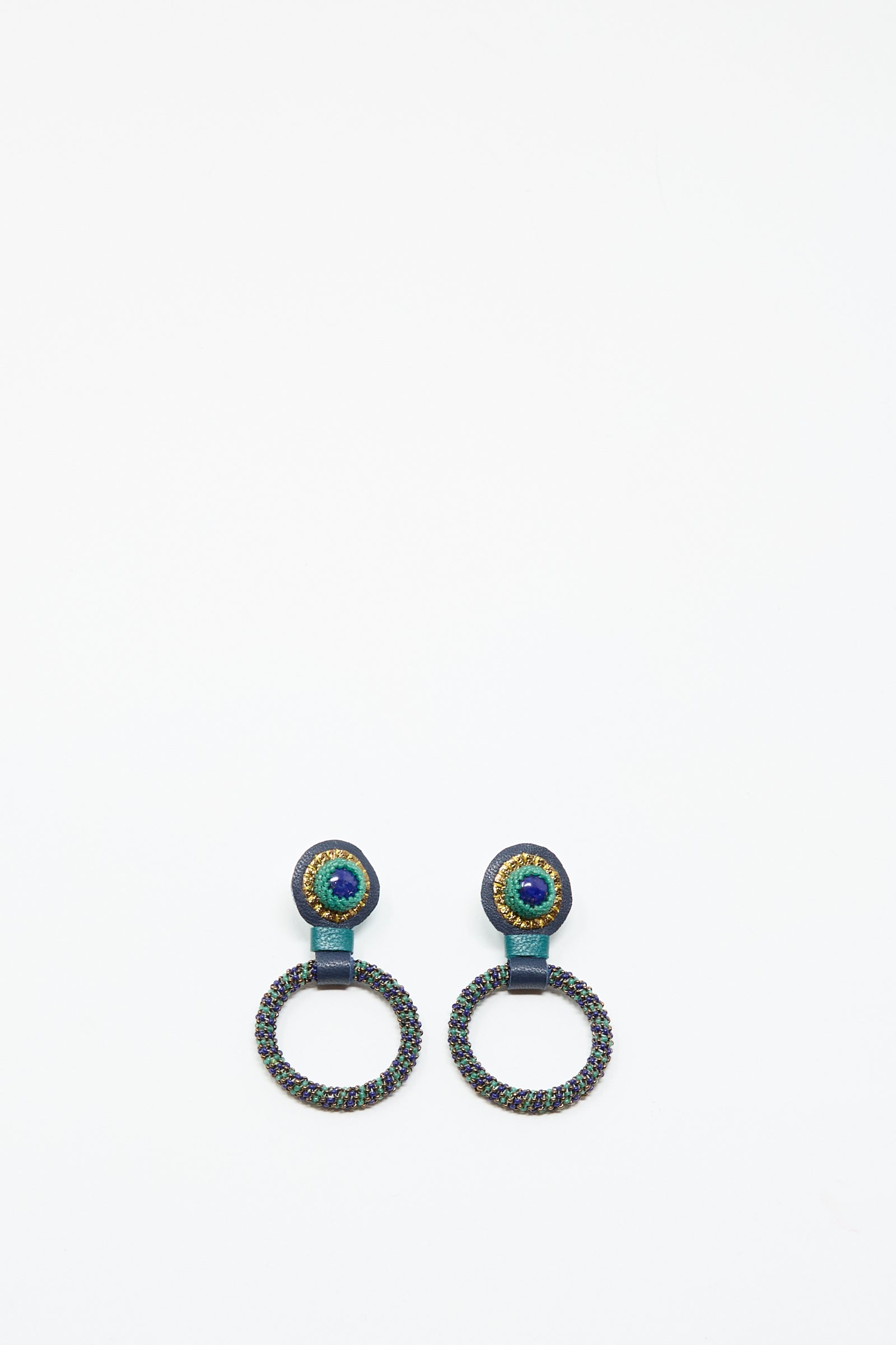 The Small Beaded Hoops in Blue with Lapis by Robin Mollicone feature multicolored beads and a prominent lapis stone at the top, handmade in NYC and shown on a simple white background.