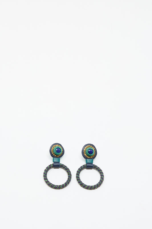 The Small Beaded Hoops in Blue with Lapis by Robin Mollicone feature multicolored beads and a prominent lapis stone at the top, handmade in NYC and shown on a simple white background.