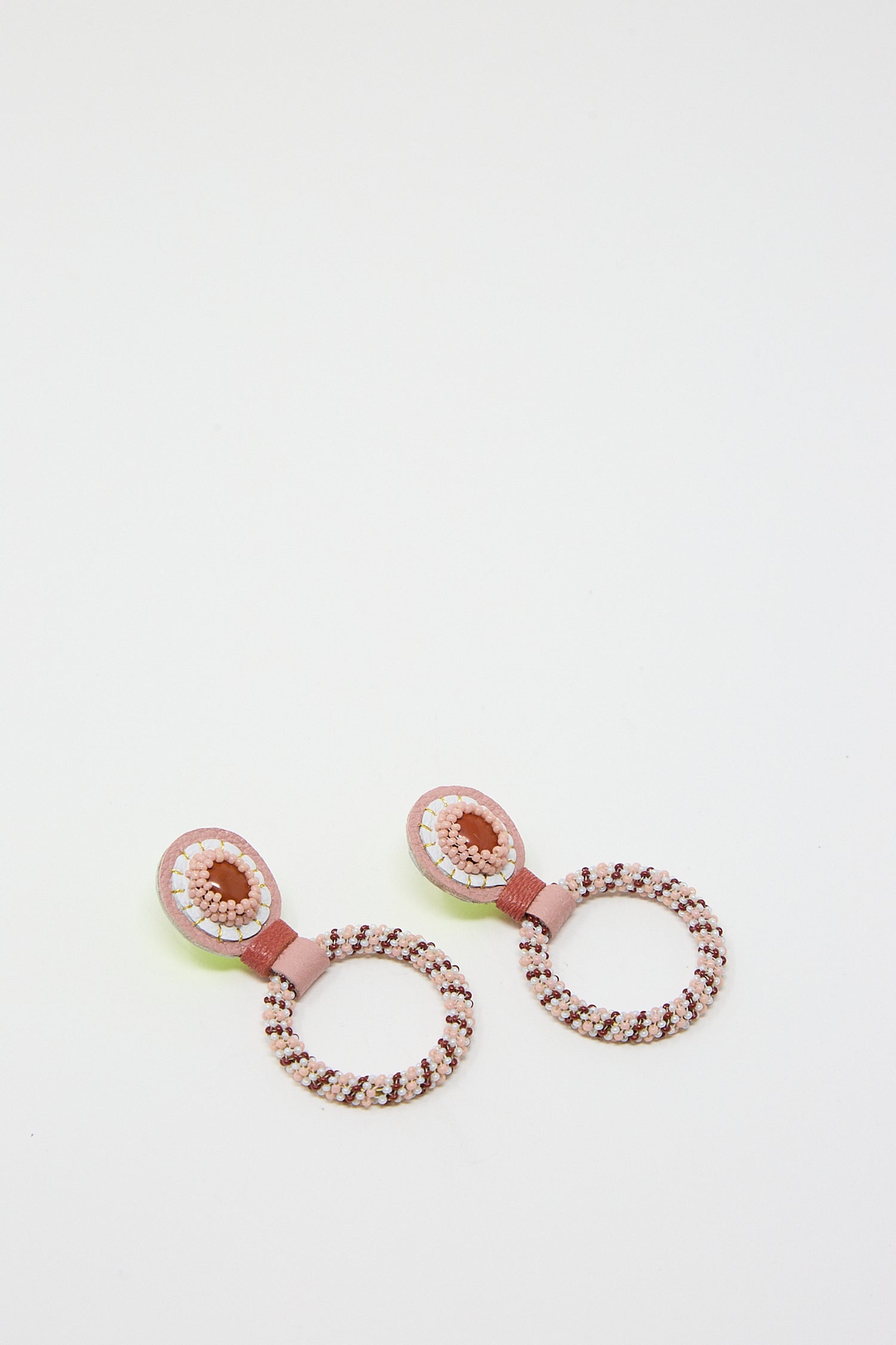 Pair of Small Beaded Hoops in Red Jasper stones by Robin Mollicone on white background.