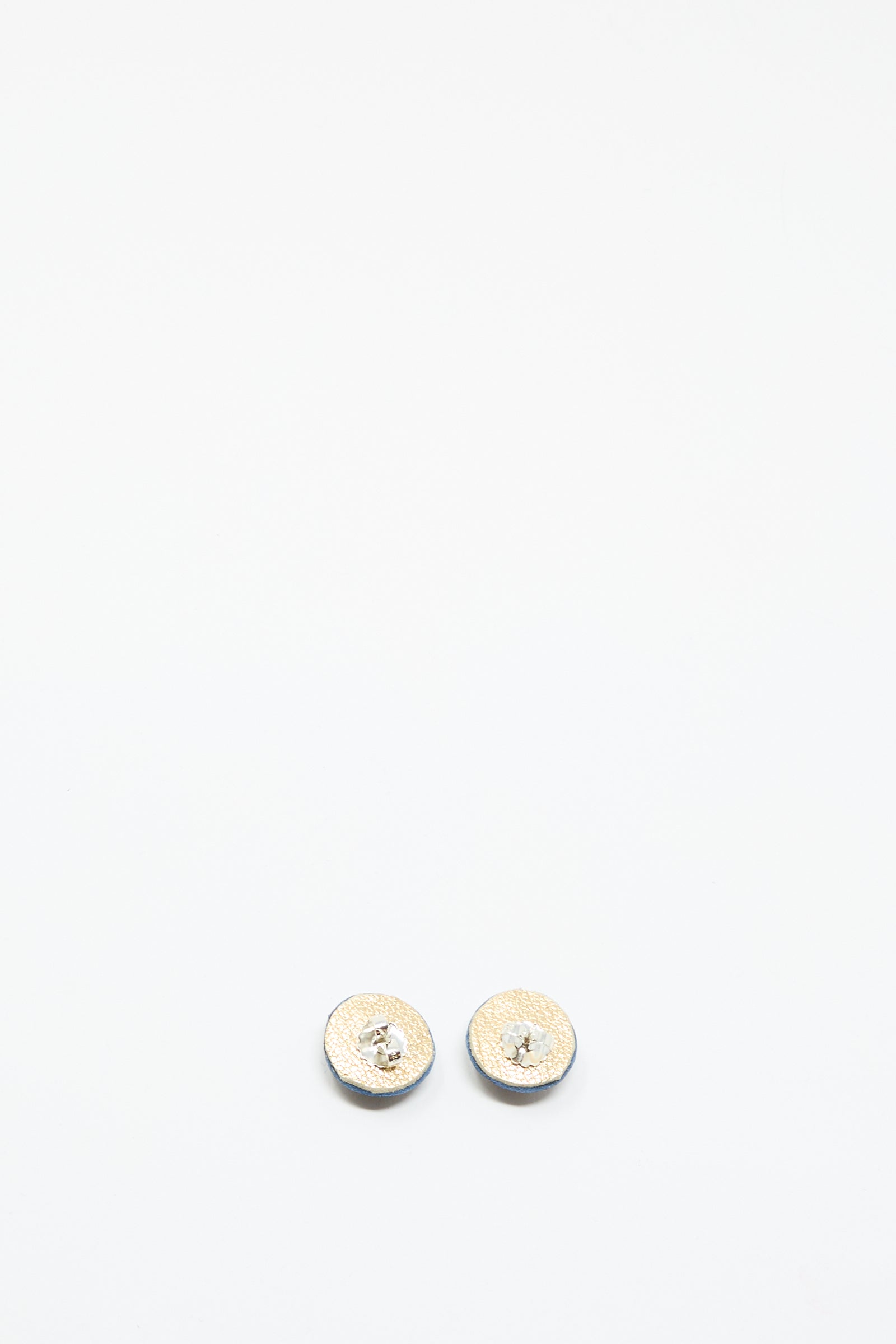 A pair of small, round Robin Mollicone Stud Earrings in Blue with Azurite, featuring a clear central gemstone, shown against a plain white background.