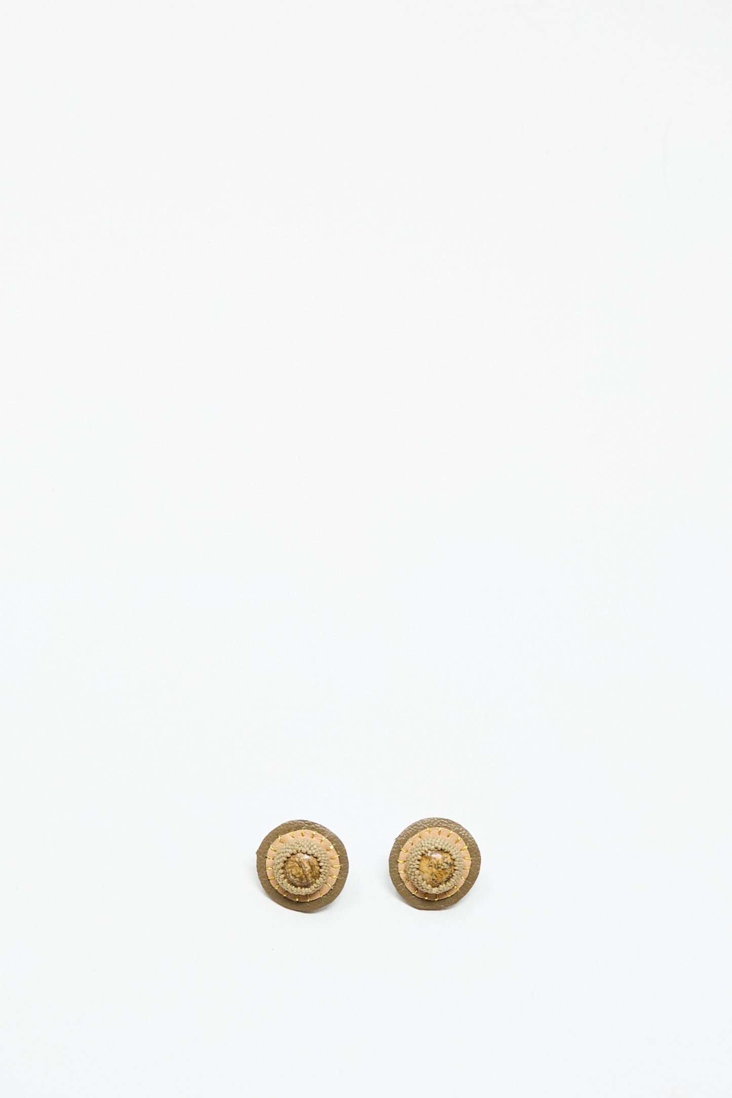 Two small, round Stud Earrings in Brown with Picture Jasper by Robin Mollicone are shown side by side on a plain white background near the bottom of the image.