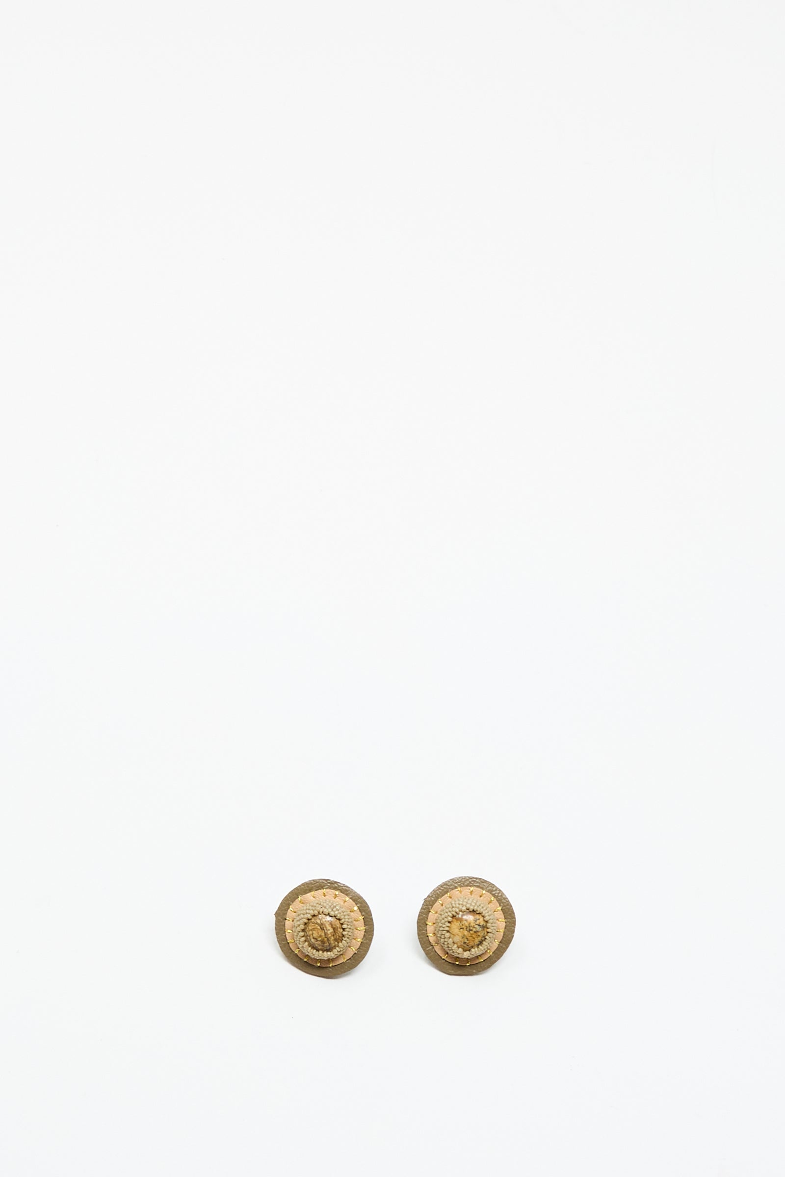 Two small, round Stud Earrings in Brown with Picture Jasper by Robin Mollicone are shown side by side on a plain white background near the bottom of the image.