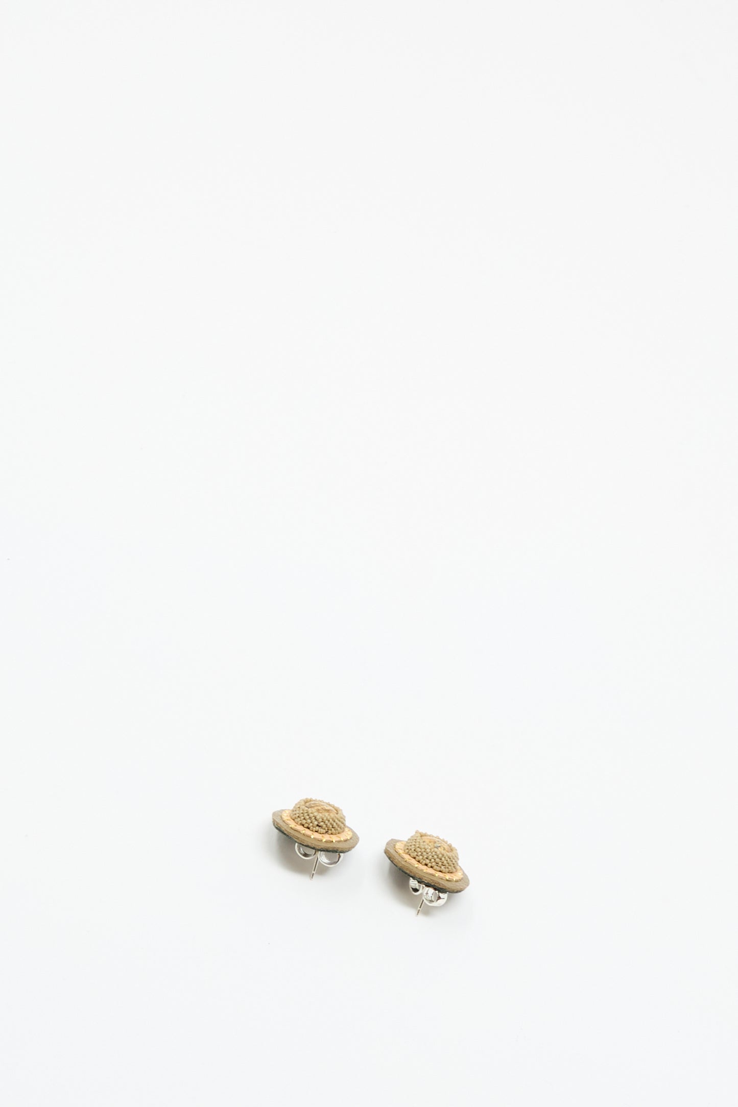 A pair of Stud Earrings in Brown with Picture Jasper by Robin Mollicone, featuring small, planet-shaped handmade designs with silver fastenings, displayed on a plain white background.