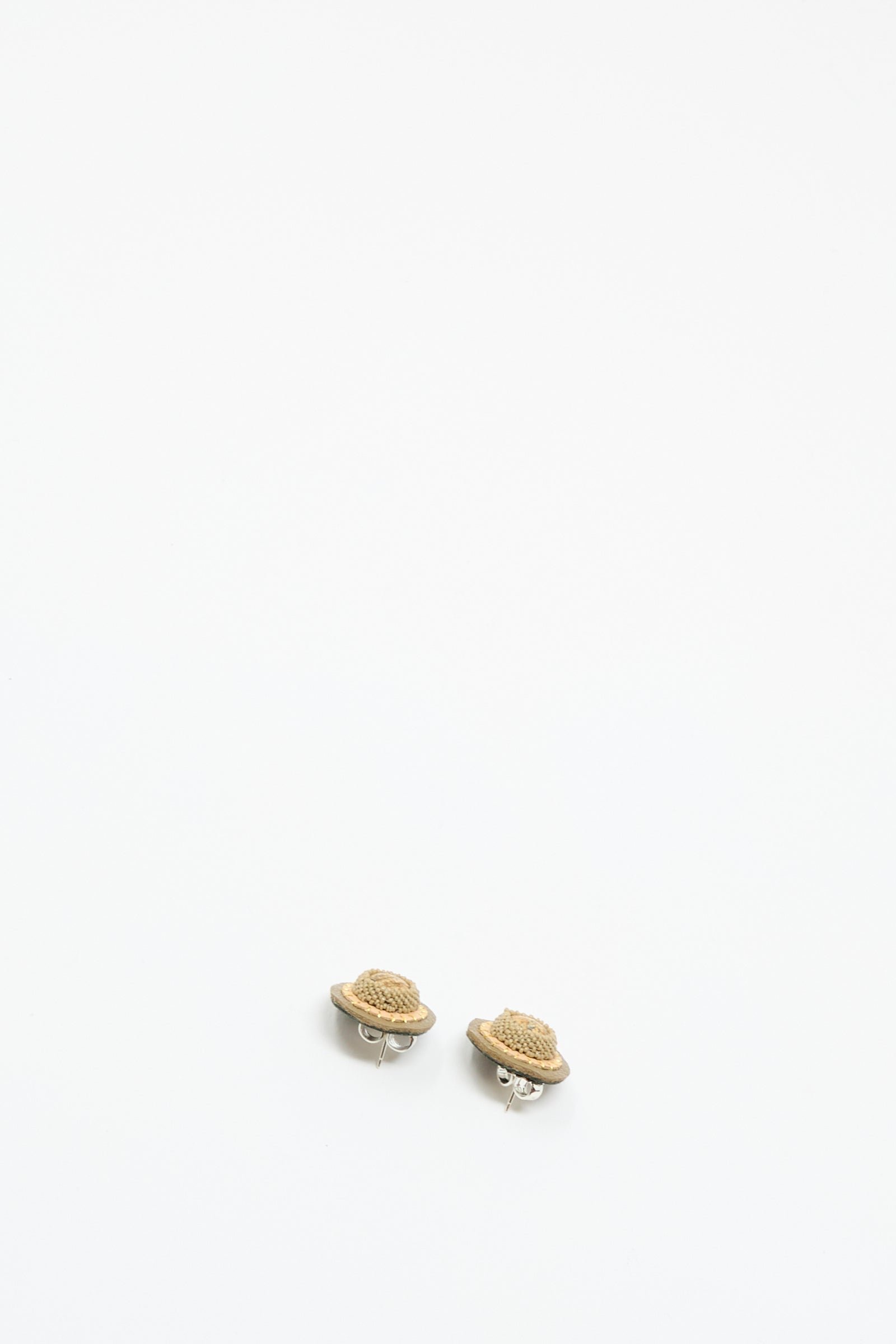 A pair of Stud Earrings in Brown with Picture Jasper by Robin Mollicone, featuring small, planet-shaped handmade designs with silver fastenings, displayed on a plain white background.