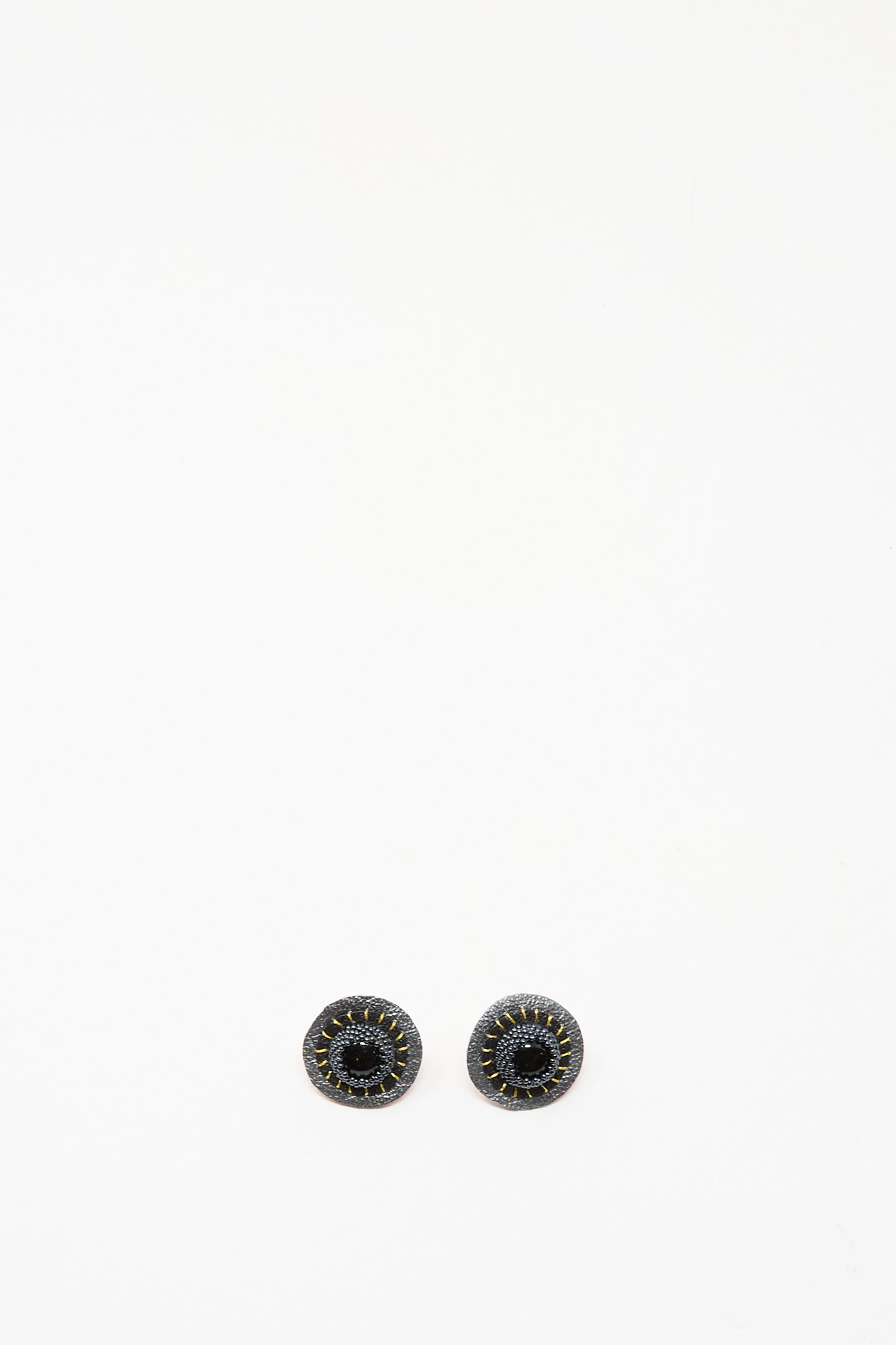 A pair of Robin Mollicone Stud Earrings in Onyx, featuring round black stones with stitched detailing, shown on a plain white background.