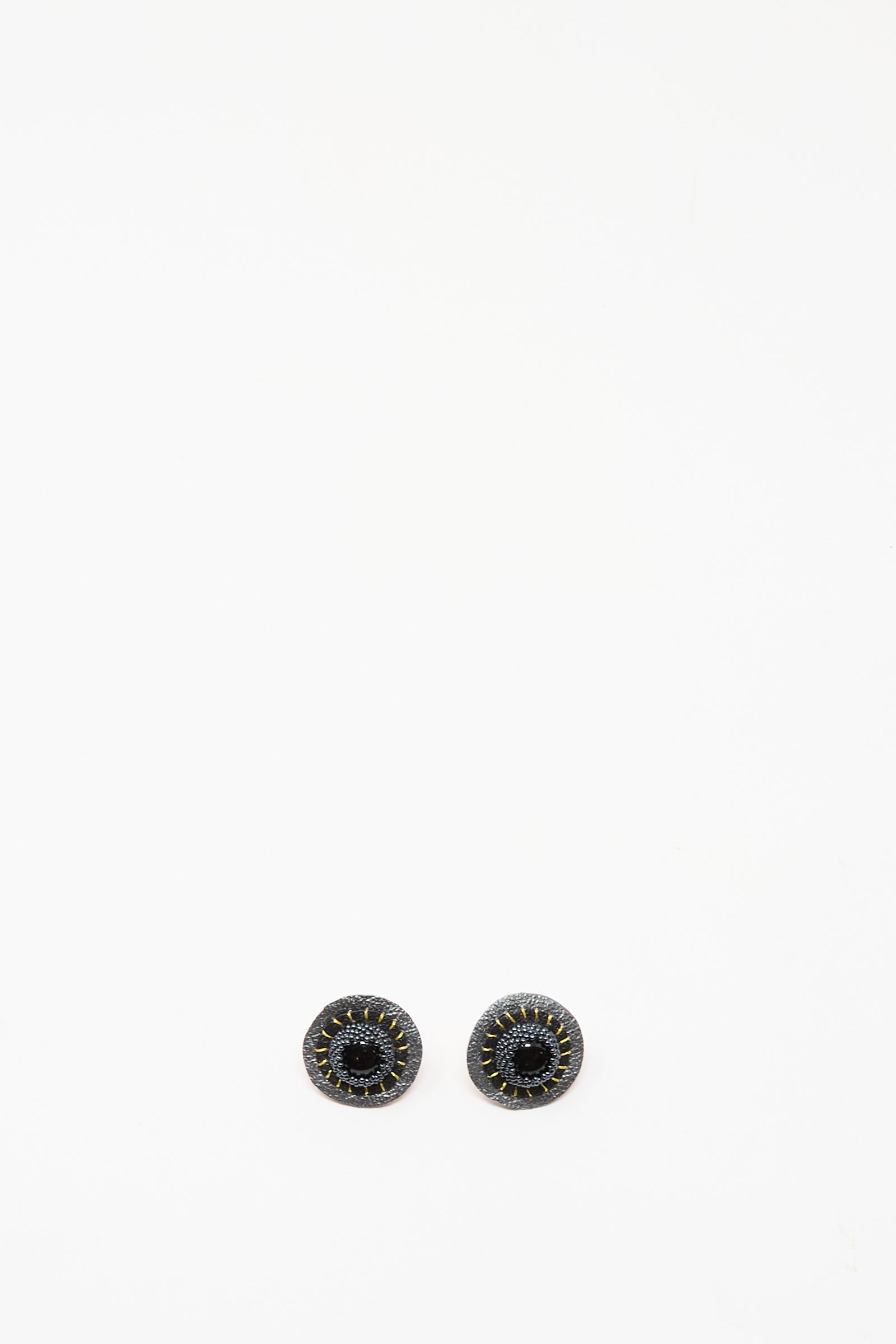 A pair of Robin Mollicone Stud Earrings in Onyx, featuring round black stones with stitched detailing, shown on a plain white background.