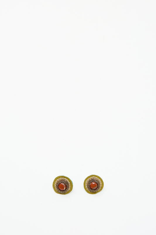 The Stud Earrings in Red Jasper by Robin Mollicone are round, handmade earrings with a gold outer ring and Red Jasper center, shown on a plain white background.