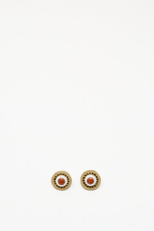 Robin Mollicone's Stud Earrings in Red Jasper showcase handmade design with a red jasper-inspired center and gold-toned outer rings, beautifully displayed on a plain white background.