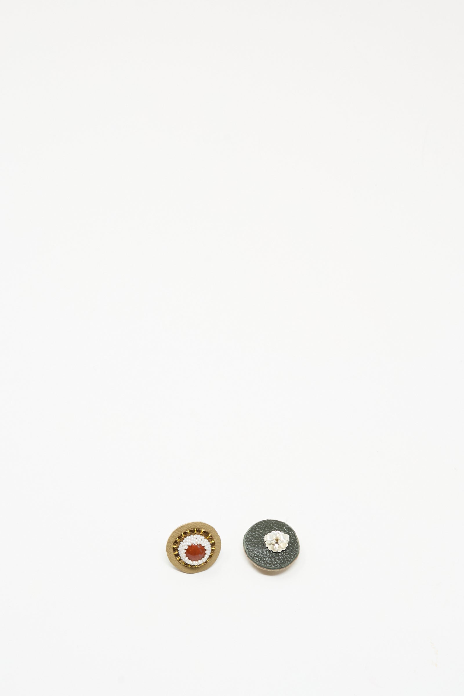 Two small, round Stud Earrings in Red Jasper by Robin Mollicone are displayed side by side on a plain white background.