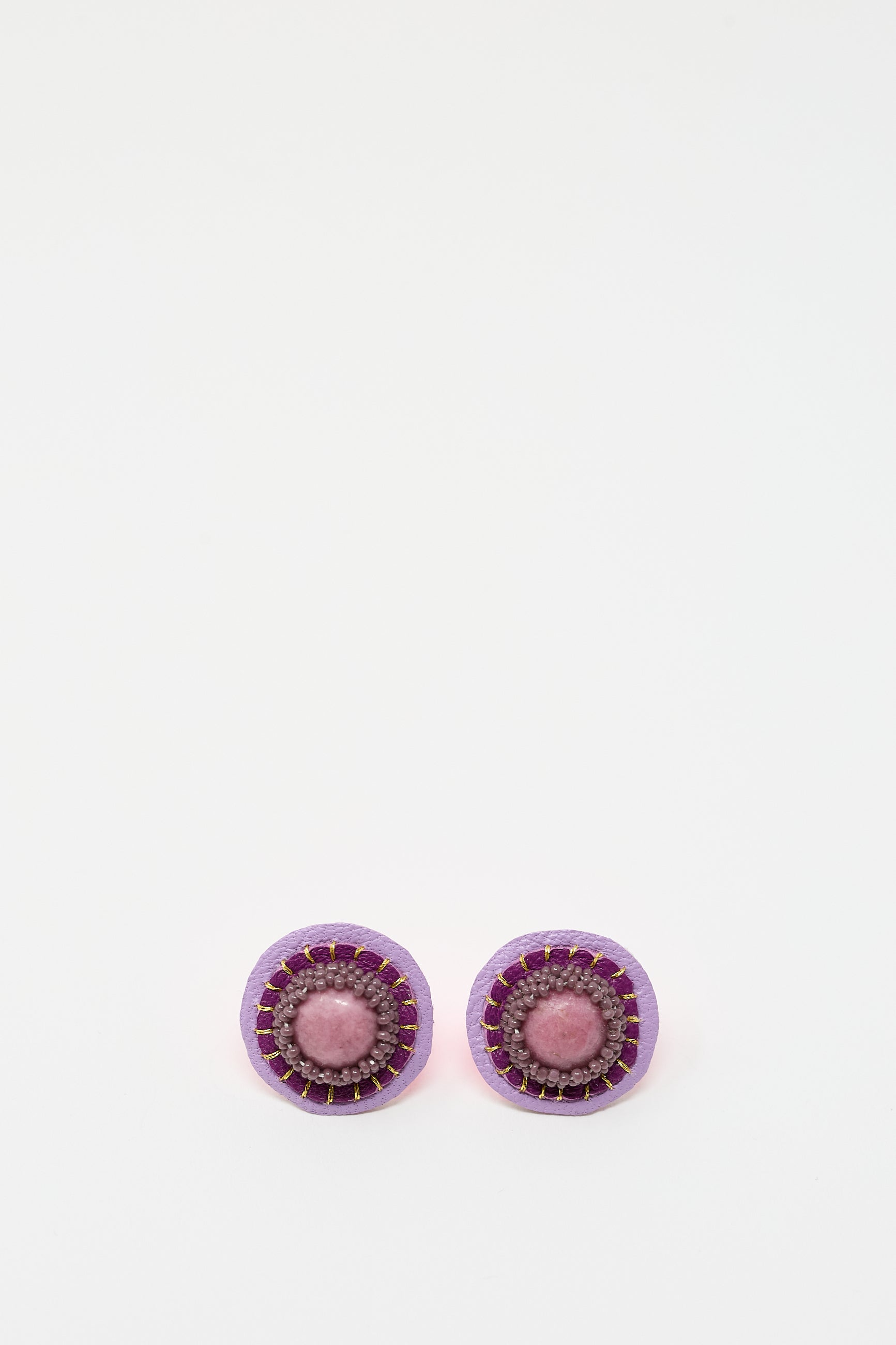 A pair of Robin Mollicone Stud Earrings in Rhodonite featuring a purple outer ring, a pink middle ring, and a central pink rhodonite bead, displayed on a plain white background.