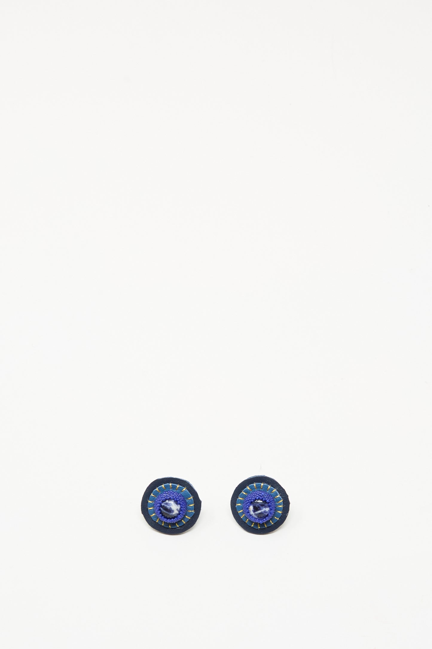 The Robin Mollicone Stud Earrings in Sodalite feature small, round blue and black stone studs set on sterling silver findings, shown against a white background.