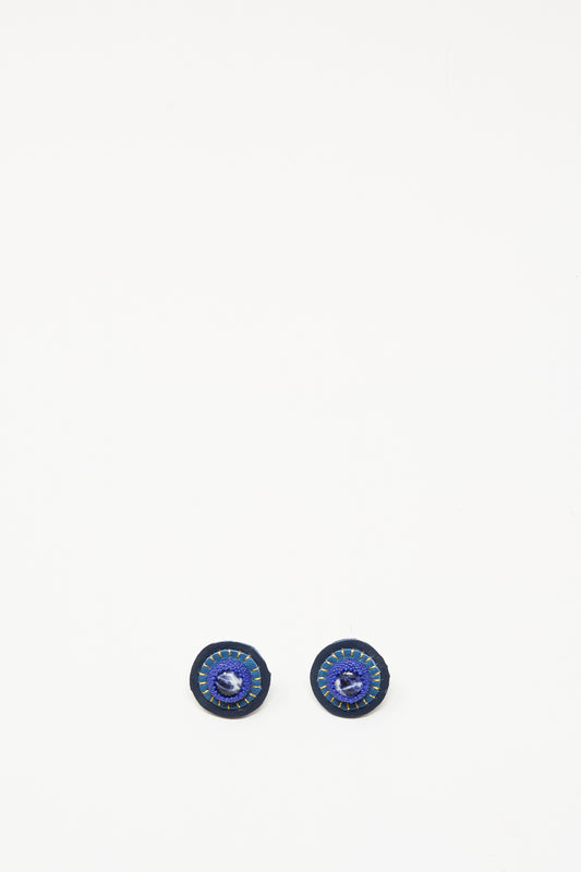 The Robin Mollicone Stud Earrings in Sodalite feature small, round blue and black stone studs set on sterling silver findings, shown against a white background.
