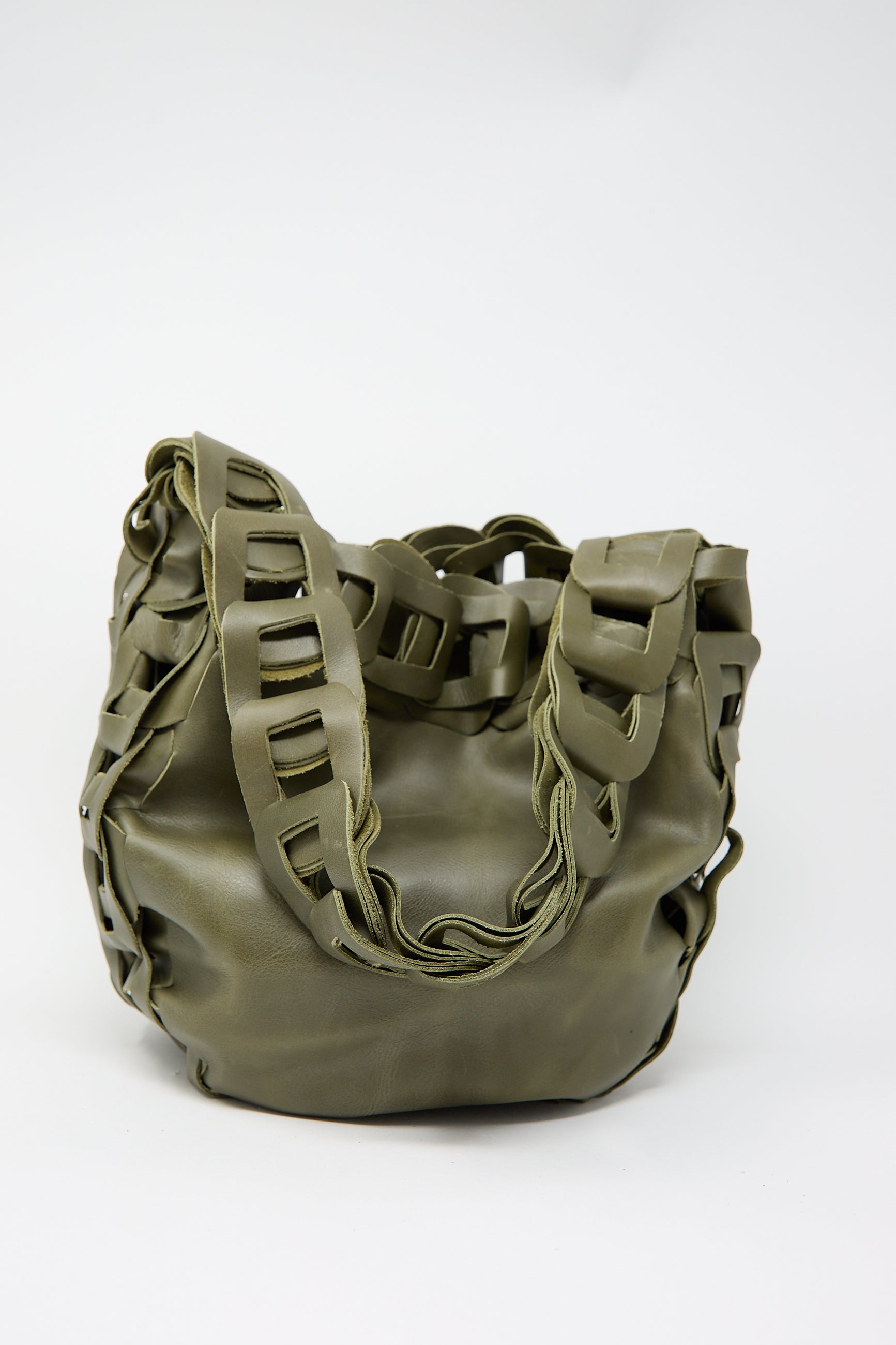 The Leather Drum Bag in Olive by SC103, featuring a unique chain-link design and a soft, rounded shape, sits against a plain background.