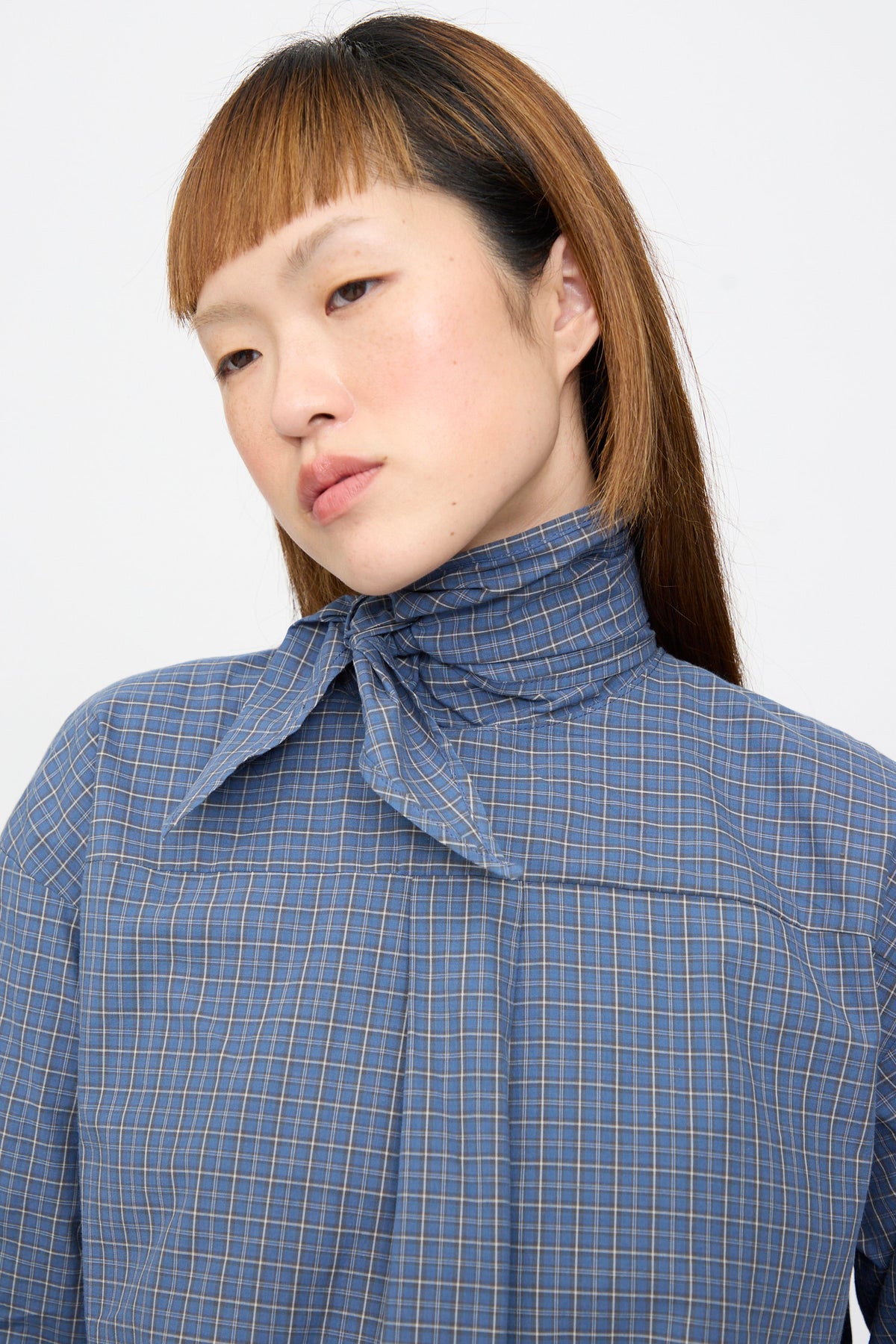 SC103 Plaid Poplin Compass Blouse in Aerial, a blue plaid cotton blouse with a high neck tie.