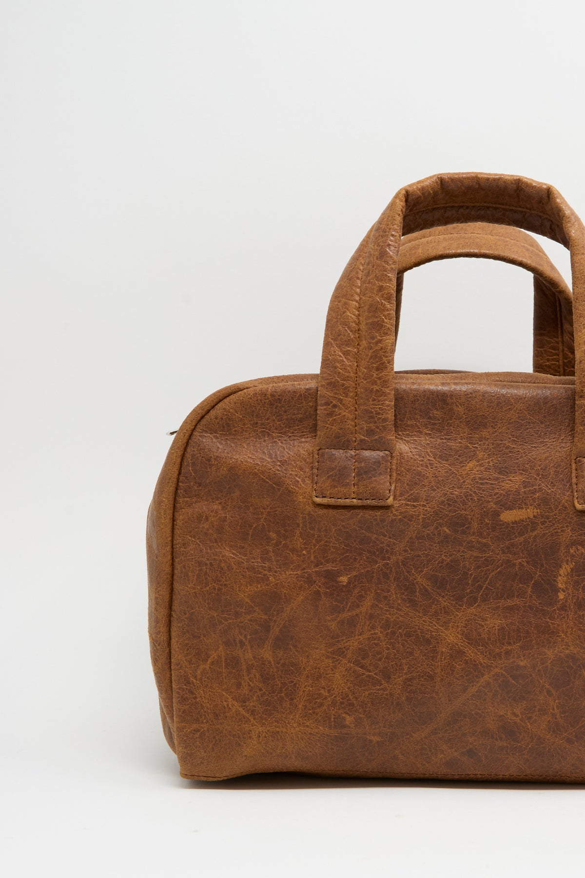 Sabina Leather The Bowling Bag in brown with two top handles.