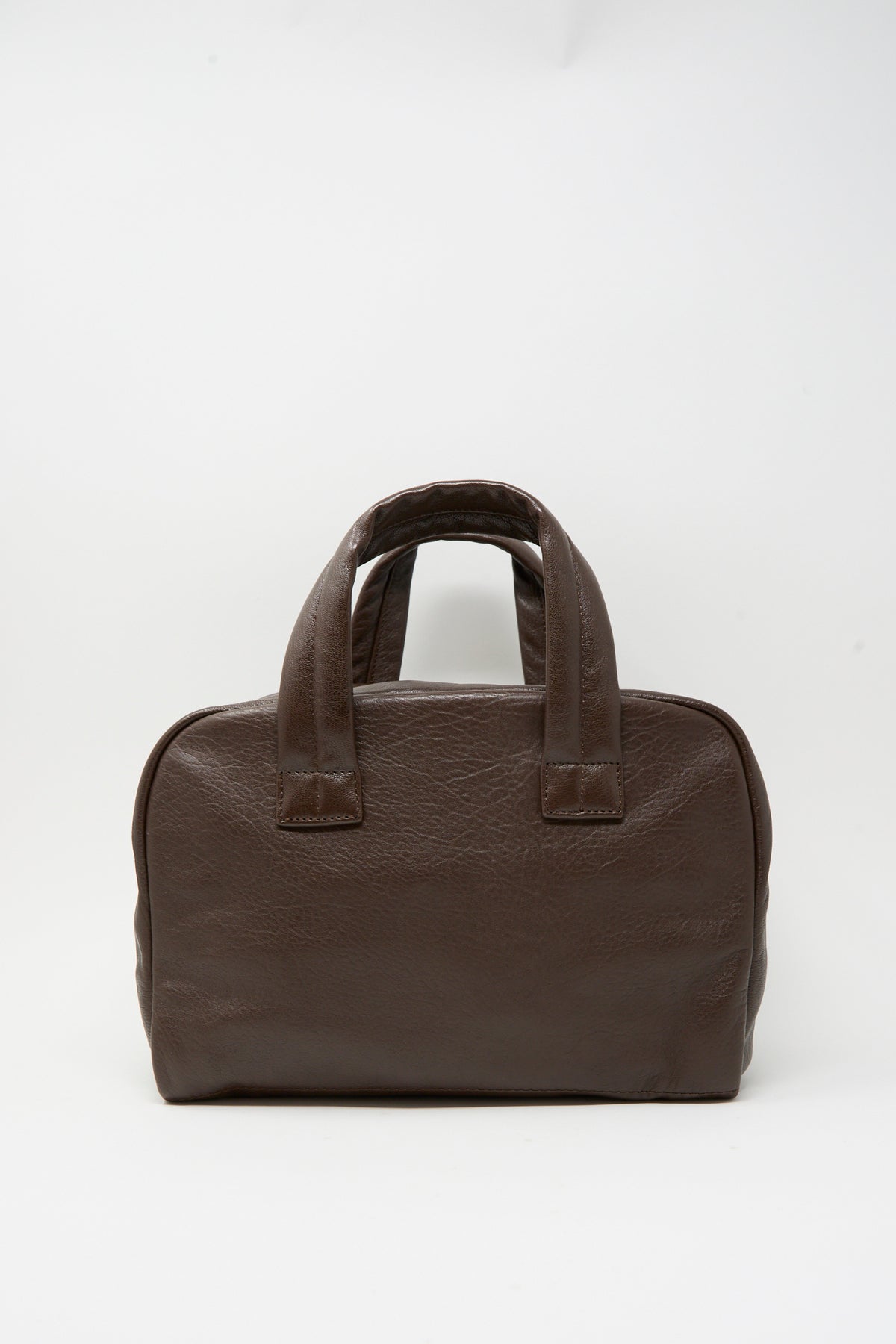 Dark brown Leather The Bowling Bag by Sabina with two top handles.