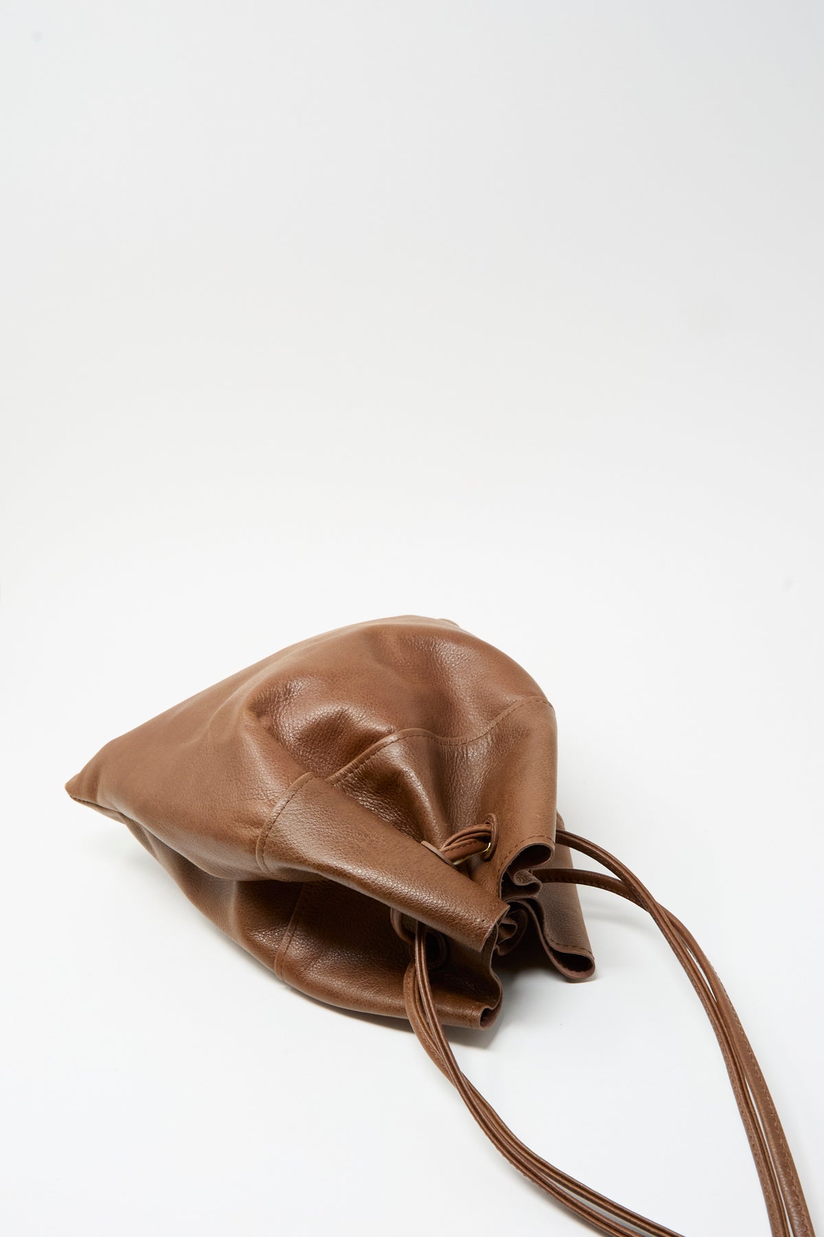 Sabina Leather Hansi Bag in brown, a drawstring pouch with a shoulder strap.
