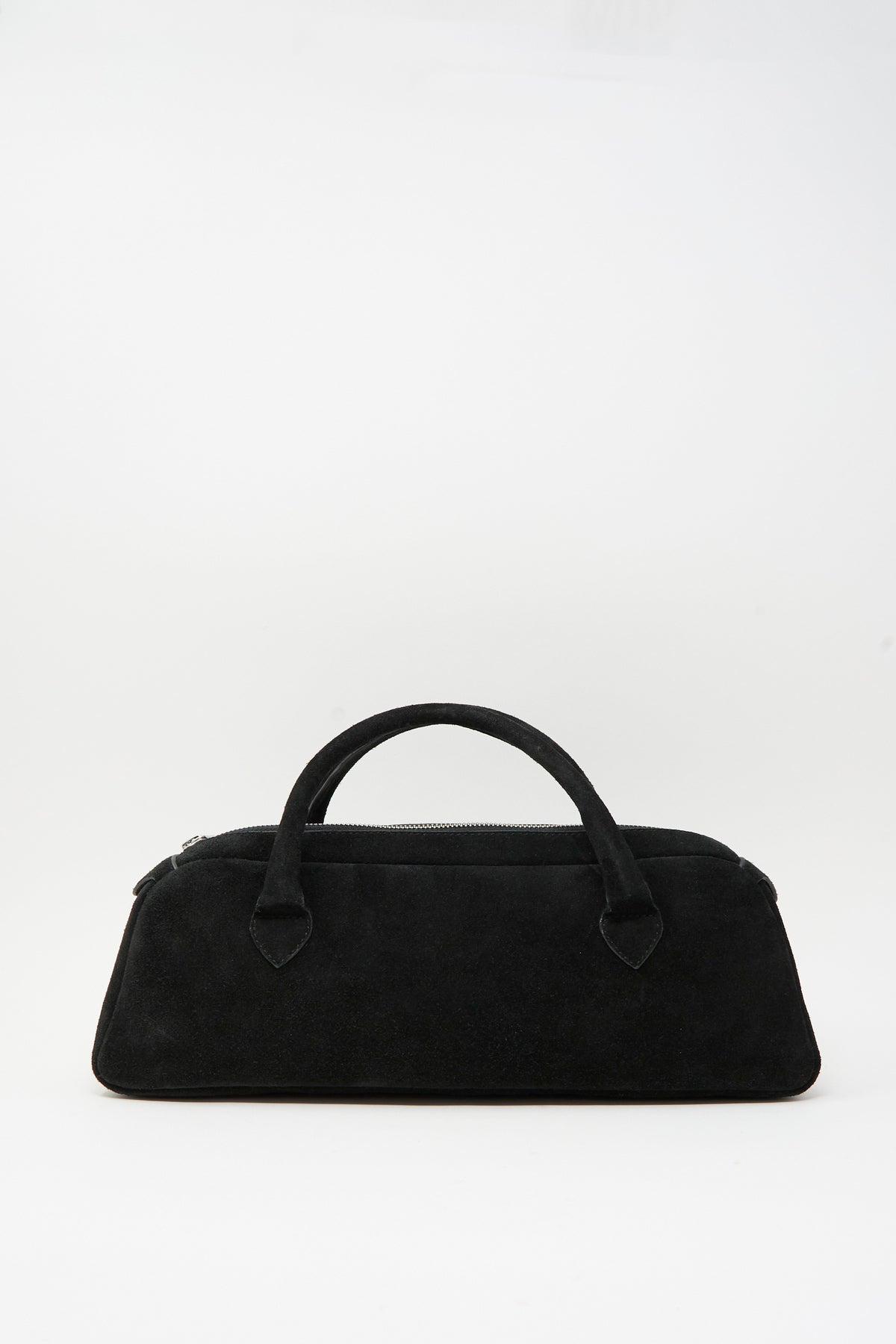 Sabina Suede The Bottle Bag in black, featuring a horizontal rectangular body and two top handles for a chic take on the classic small bag.