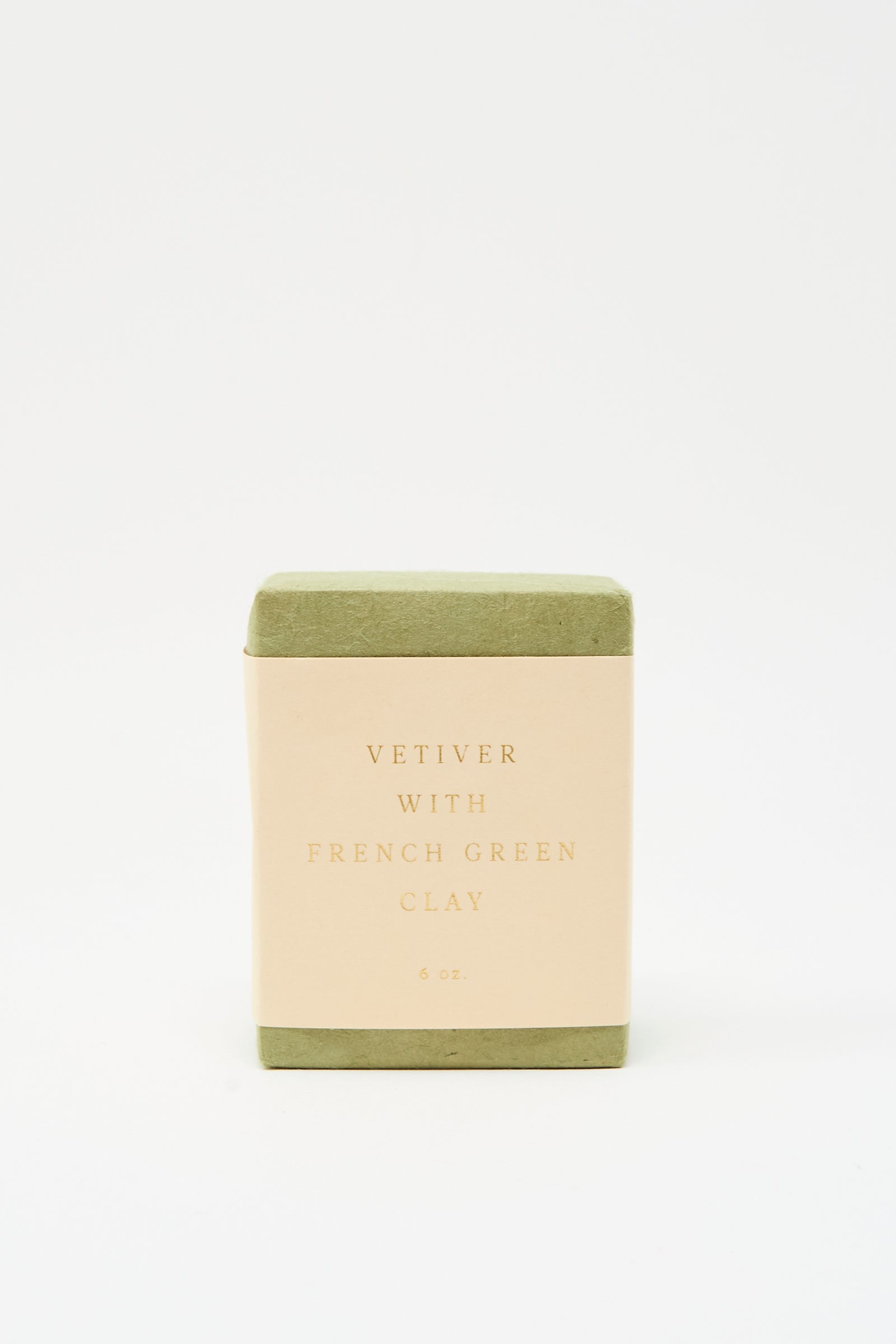 A rectangular bar of SAIPUA Soap in Vetiver with French Green Clay is shown against a white background, featuring green edges and a cream label—ideal for sensitive skin.