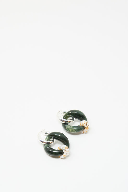 The Bad Orb Earrings in Jade by Santangelo are sterling silver hoops with dark green jade circles and small gold accents, shown against a white background.