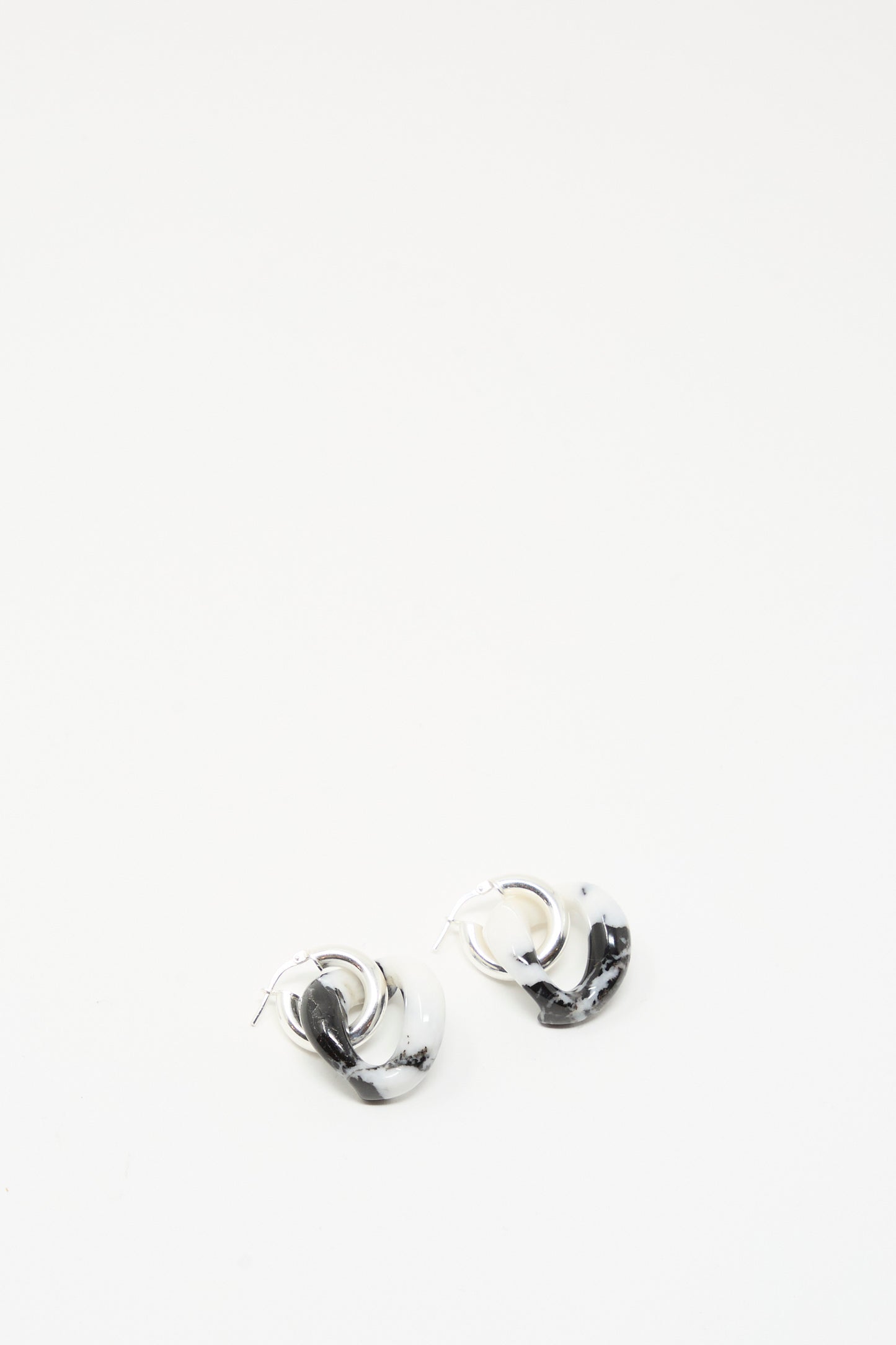 The Santangelo Bad Orb Earrings in Zebra Jasper, featuring a black and white marbled design, are displayed on a plain white background.