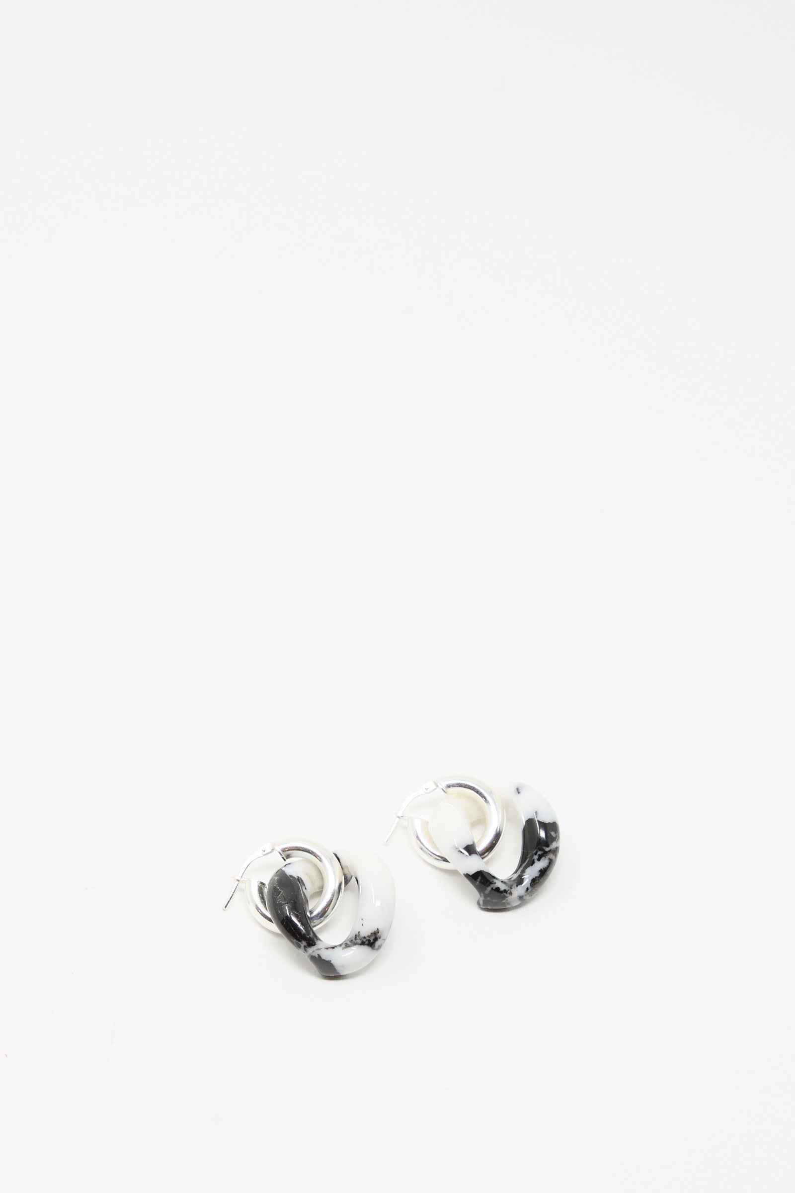 The Santangelo Bad Orb Earrings in Zebra Jasper, featuring a black and white marbled design, are displayed on a plain white background.