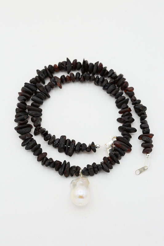 Santangelo Kitano Necklace in Black with a single fireball pearl pendant on a white background.