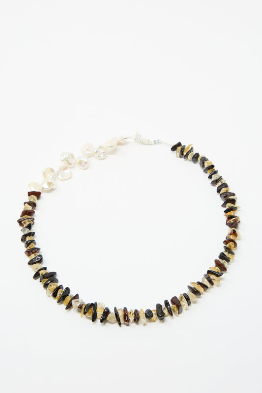 The Santangelo La Duke Necklace in Citrine and Amber Stripe features alternating irregular brown and beige stone beads with a section of freshwater keshi pearls, shown against a white background.