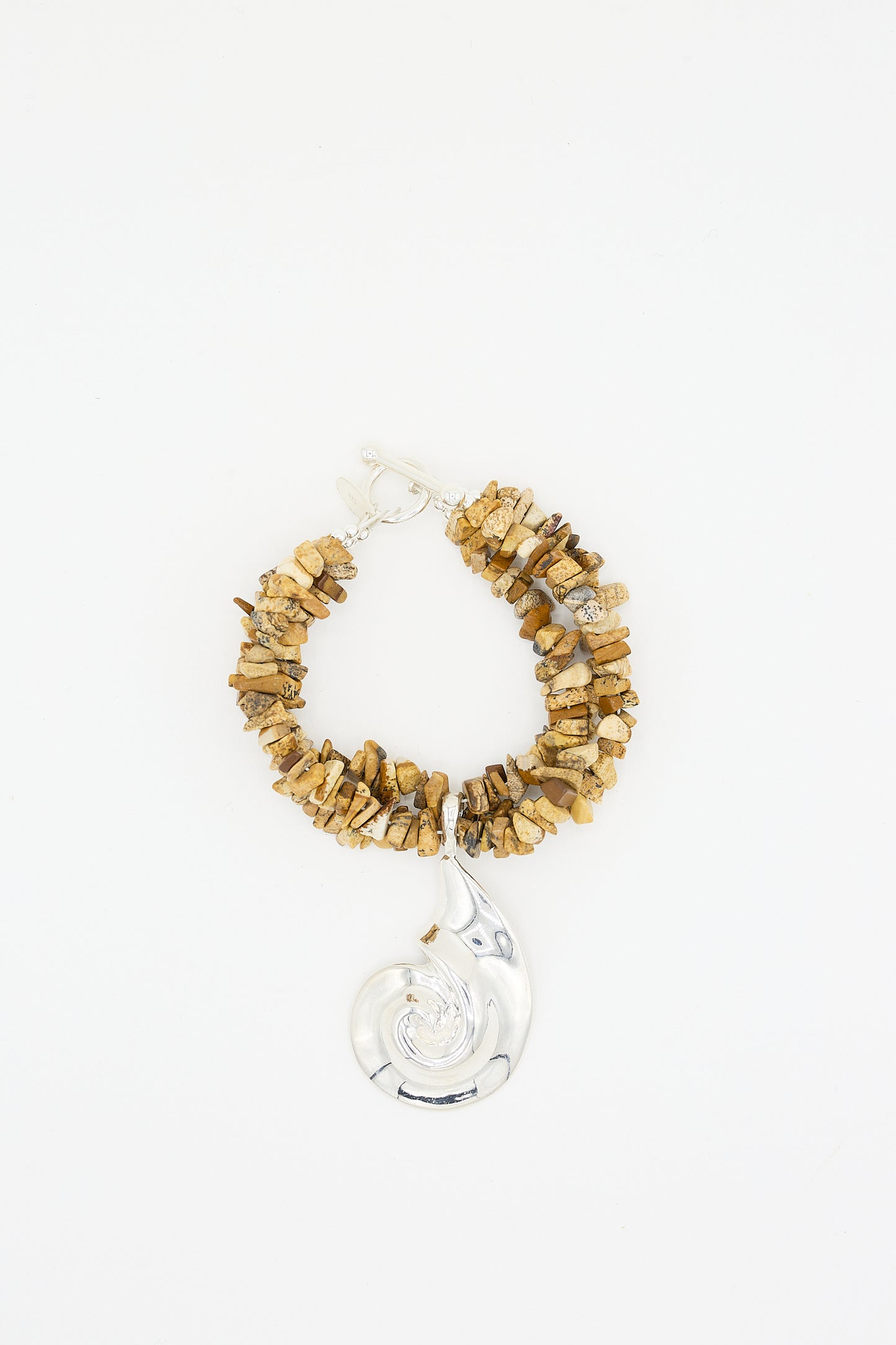 Handmade jewelry: Cata Bracelet in Sand Jasper with a sterling silver pendant on a white background by Santangelo.