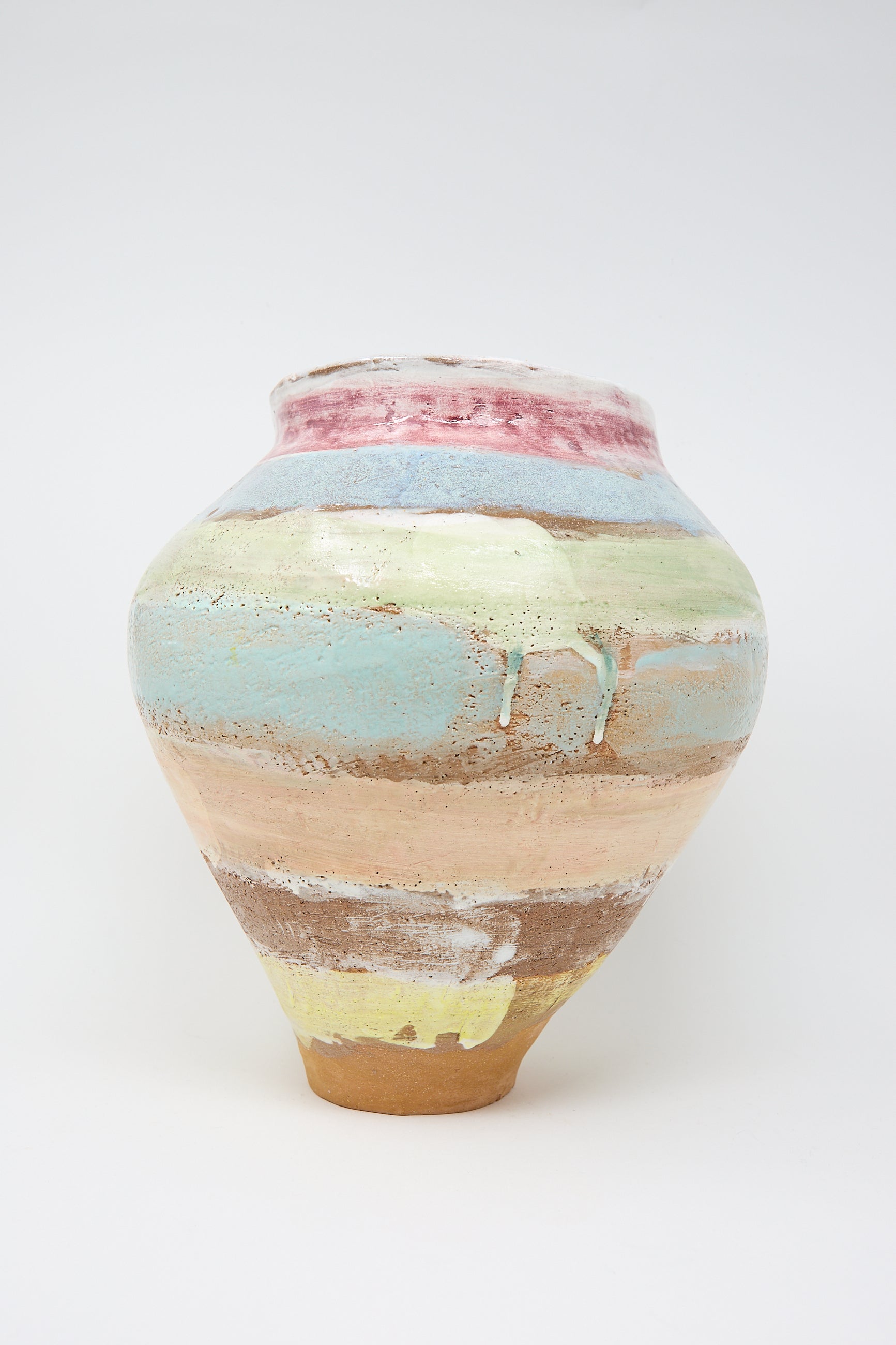 The Large Vase in Pastel Stripe by Shino Takeda features a colorful design with hand-painted horizontal pastel stripes on a neutral ceramic base.