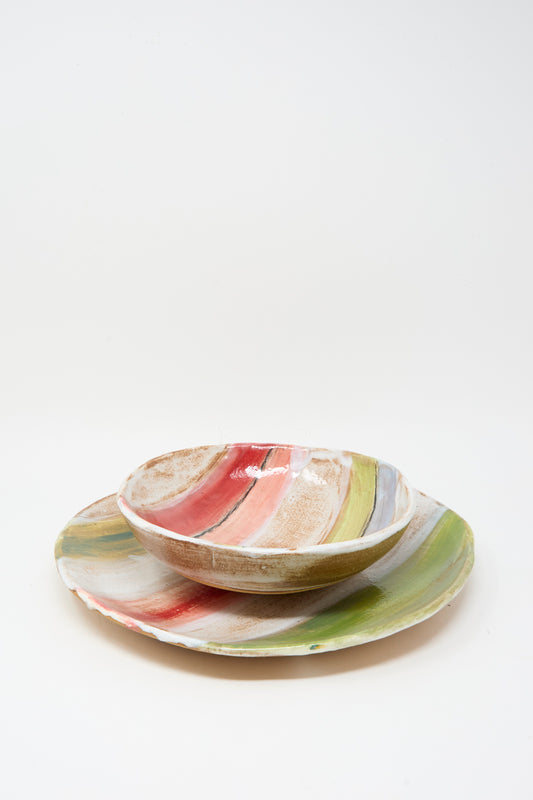 The Stripe Serving Bowl in Multi I by Shino Takeda is a ceramic bowl with colorful abstract brushstroke patterns and a unique striped glaze, expertly crafted in New York.