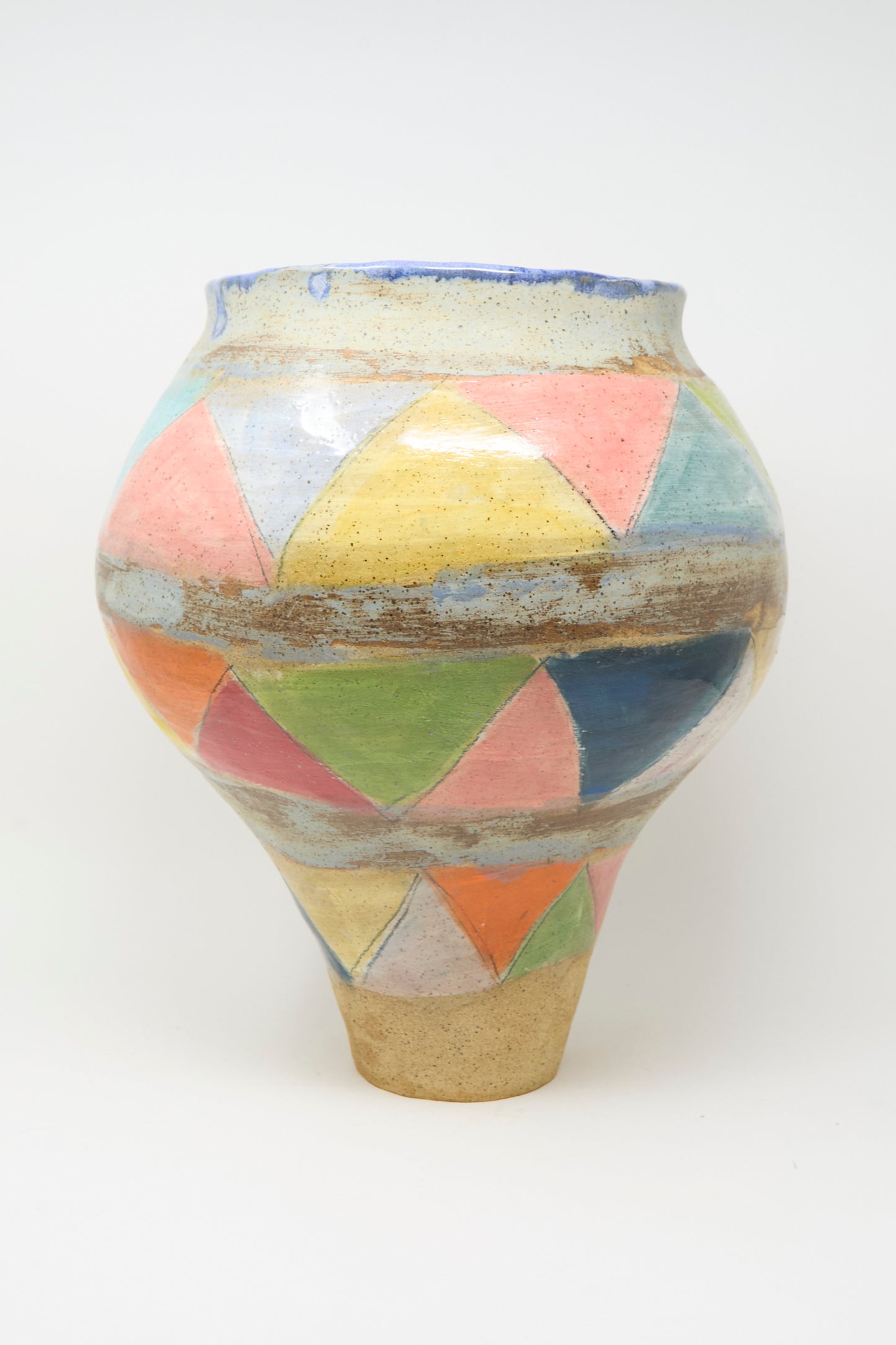 The Triangles Large Vessel in Multi by Shino Takeda is a handmade clay vase with a wide, rounded body, narrow base, and features pastel triangles on a speckled surface.