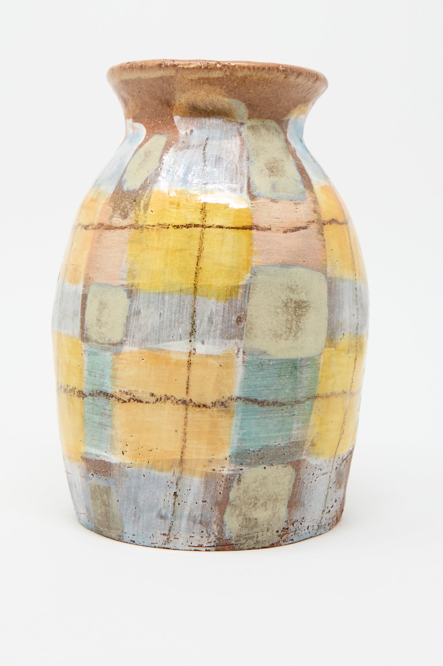 The Vase in Pastel Plaid by Shino Takeda is a hand-painted ceramic piece with a glaze finish, featuring a pastel plaid patchwork pattern in shades of yellow, blue, green, and brown.