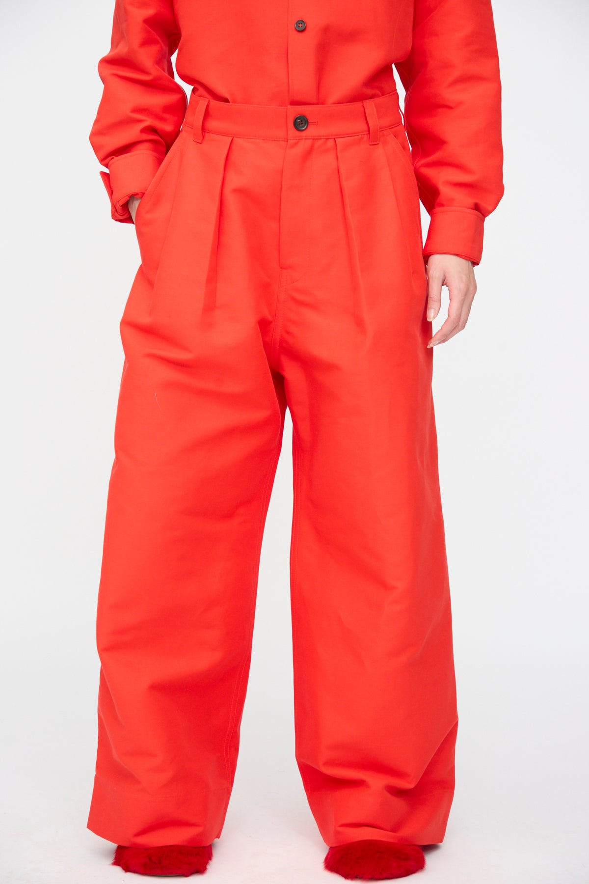 Bright red Cotton Duchesse Piaf Pant in Fire featuring a high-waisted, wide-leg silhouette with front pleats.