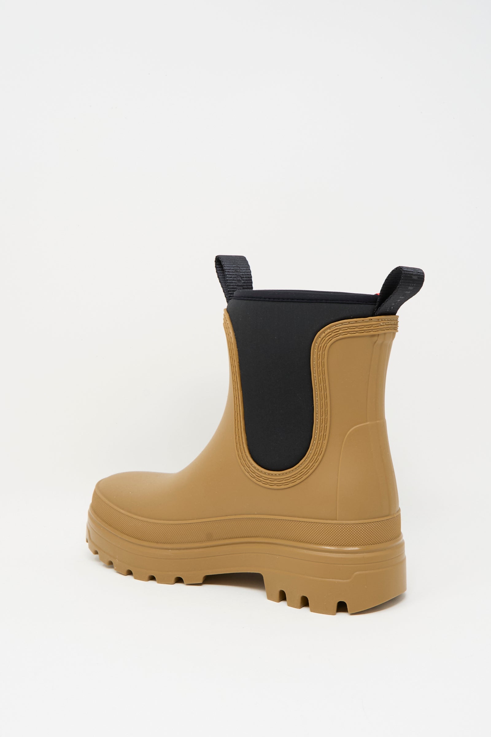 The Falk Rainboot in Caramel by Sofie D'Hoore features black elastic side panels, water-repellent rubber construction, and pull tabs, displayed against a plain white background.