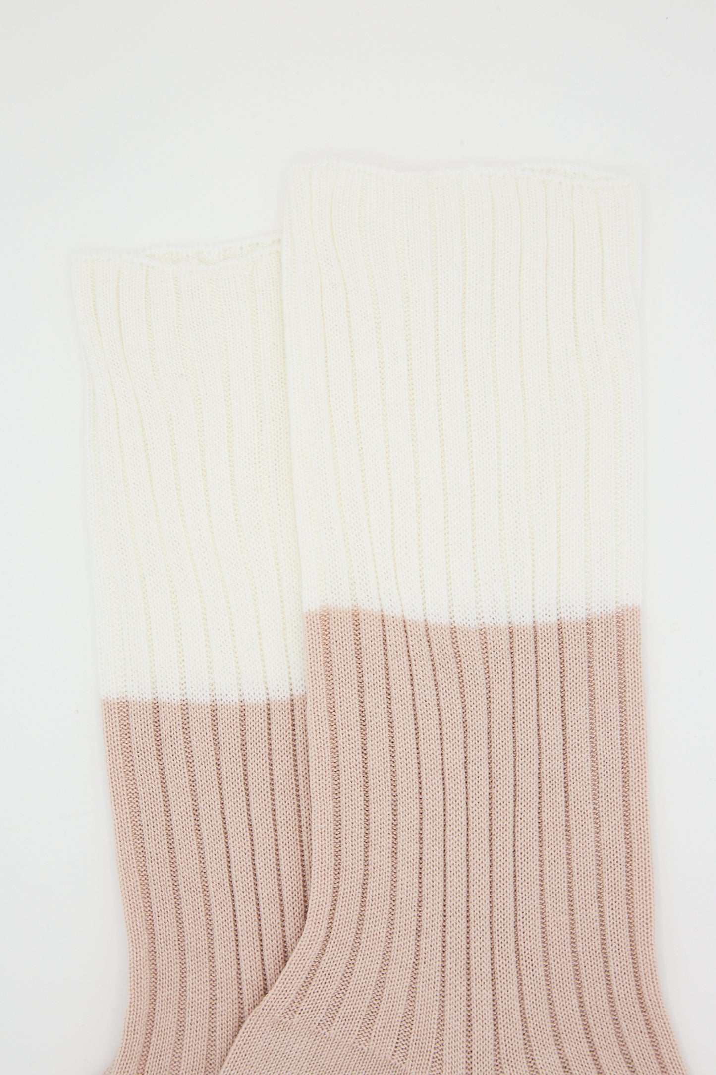A pair of Ribbed Cotton Four Crew Sock in Ivory and Nude by Sofie D'Hoore against a white background.