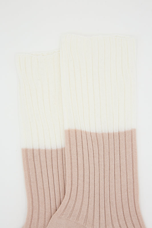 A pair of Ribbed Cotton Four Crew Sock in Ivory and Nude by Sofie D'Hoore against a white background.
