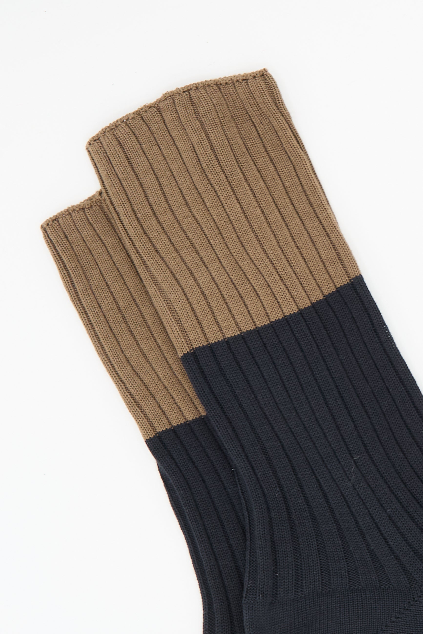 The Ribbed Cotton Four Sock in Mocha and Onyx by Sofie D'Hoore, made from 100% cotton, is displayed on a white background.