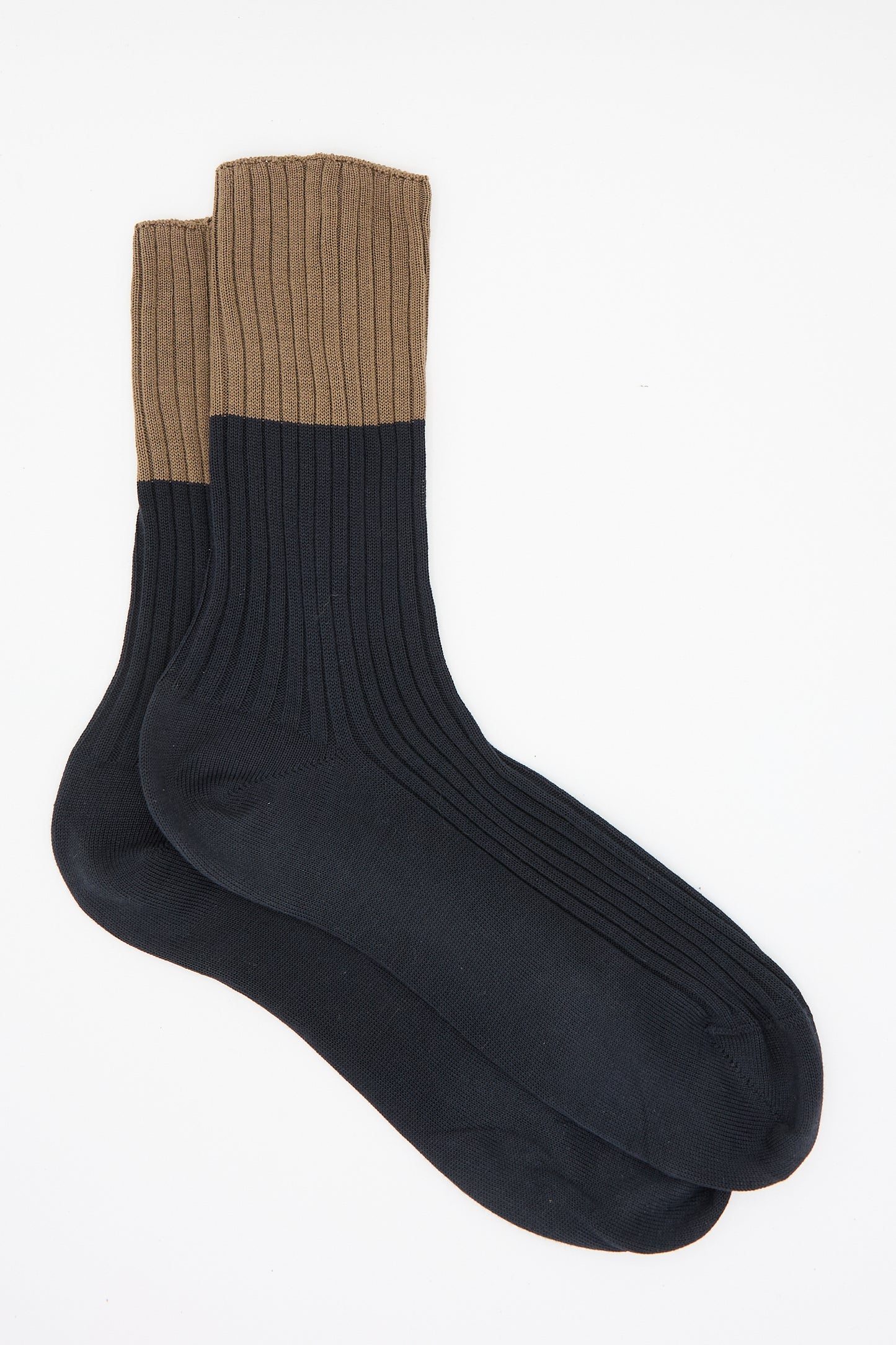 Laid flat on a white background, the Ribbed Cotton Four Sock in Mocha and Onyx by Sofie D'Hoore features brown cuffs and black feet, made entirely from 100% cotton.