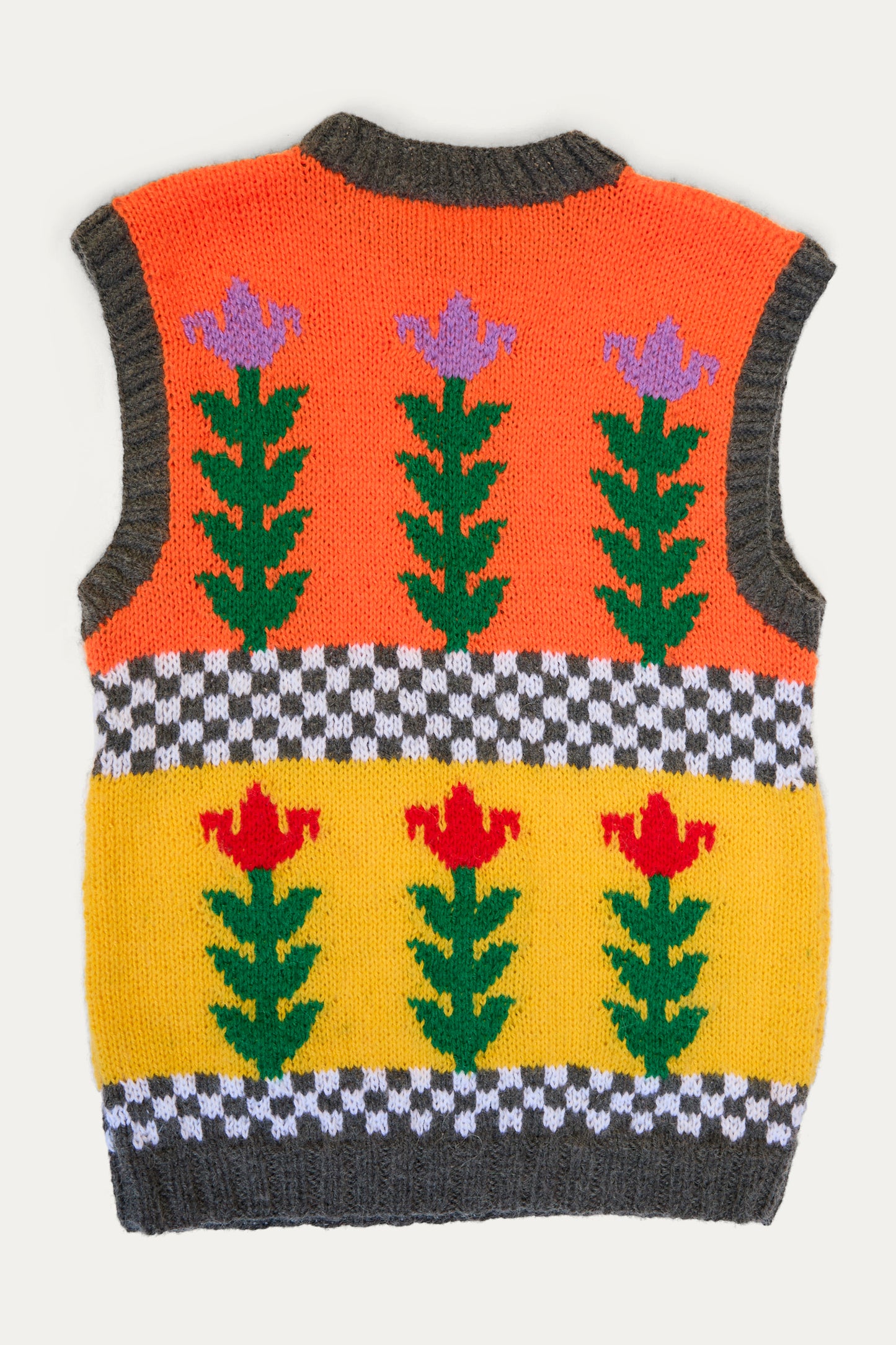 The Sofio Gongli Vest with Flowers in Orange and Yellow is a hand-knit mohair wool blend piece, featuring colorful floral patterns on an orange-yellow backdrop with a black and white flower checkered design.