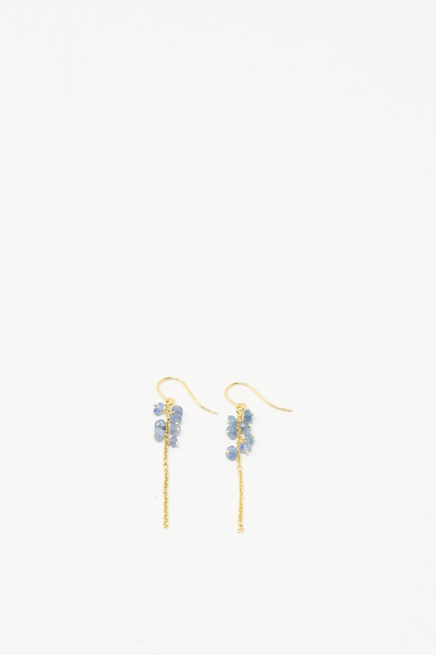 Stephanie Schneider Gold Plated Sterling Silver Earrings feature clusters of blue sapphires near the hooks, shown against a plain white background.