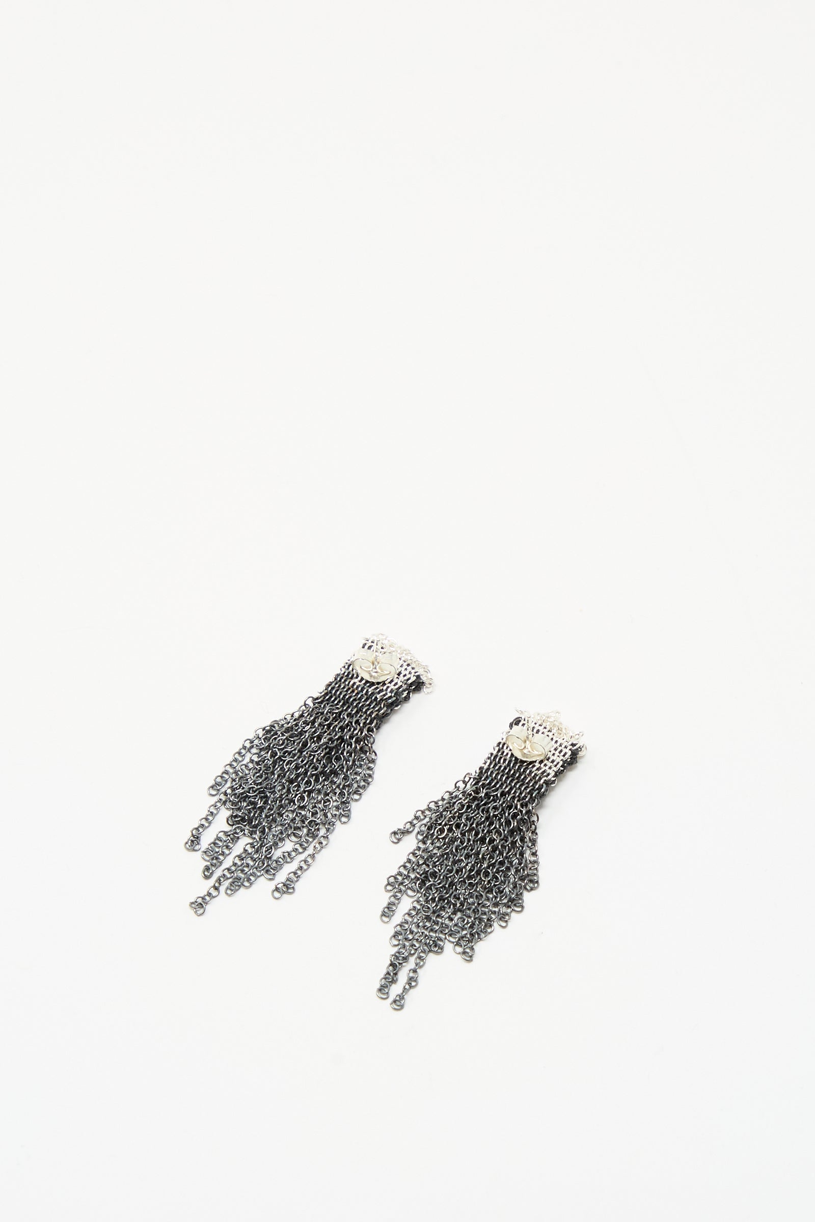 Stephanie Schneider Sterling Silver Oxidized and Silk Earrings in Anthracite, featuring multiple fringe strands, are displayed on a white background.