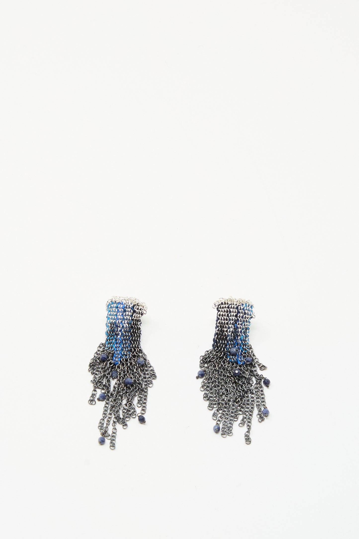 Stephanie Schneider’s Sterling Silver and Silk Earrings in Blue with Sapphires feature multiple dangling chains and bead details, shown against a plain white background.