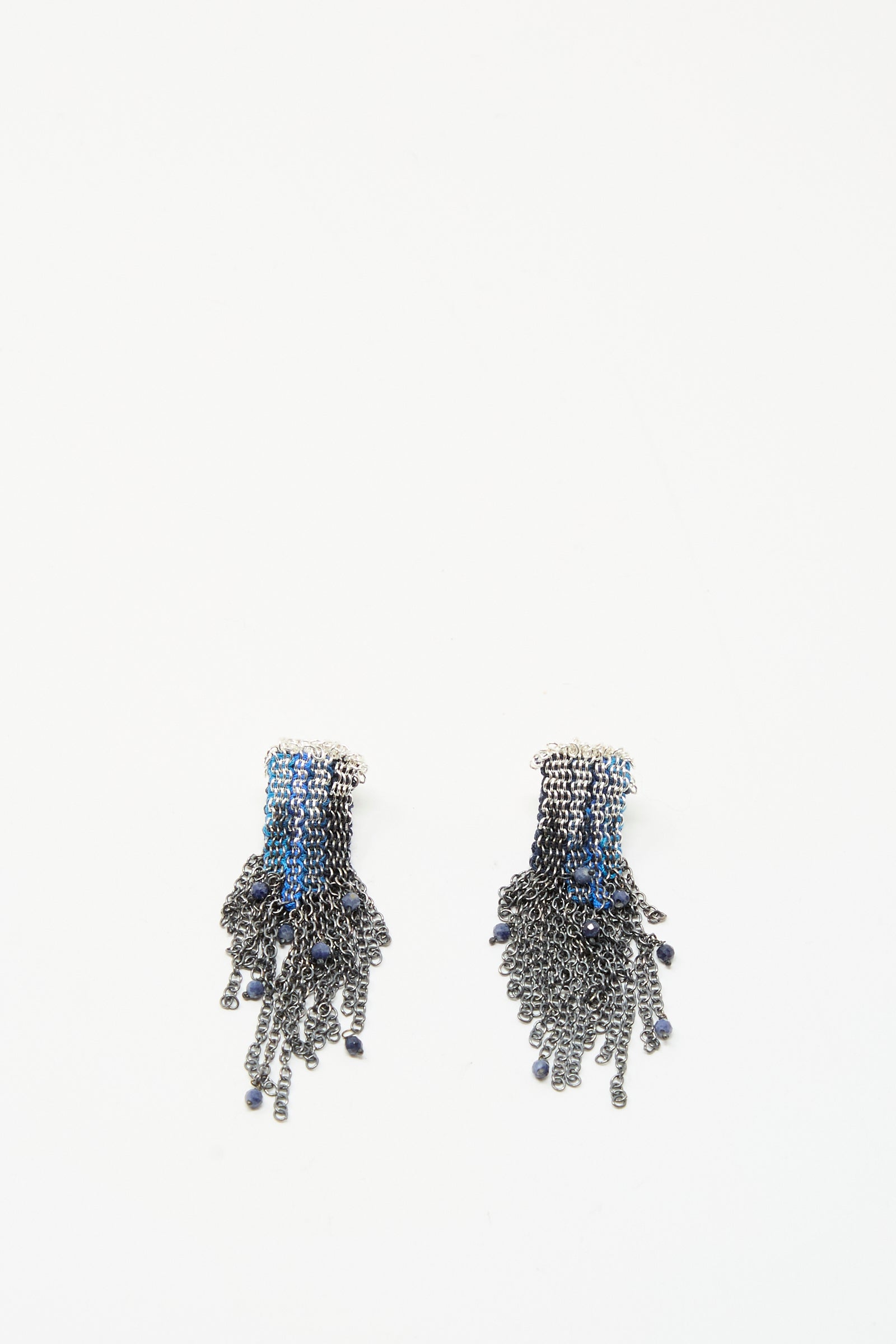 Stephanie Schneider’s Sterling Silver and Silk Earrings in Blue with Sapphires feature multiple dangling chains and bead details, shown against a plain white background.