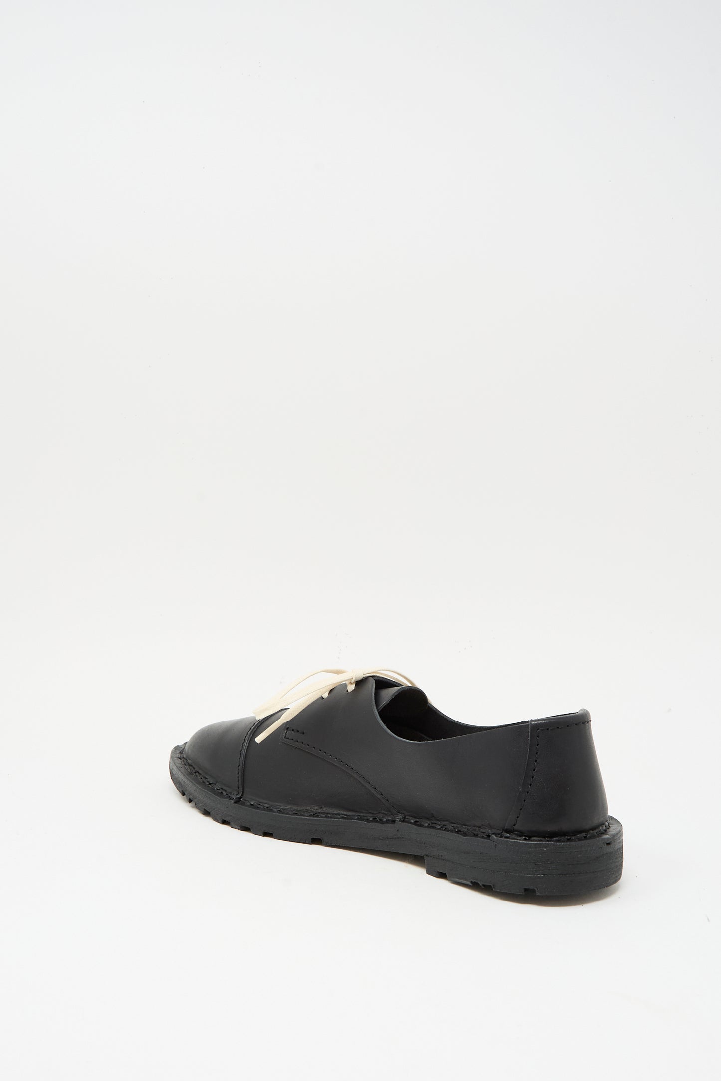 The Steve Mono Leather Oxford in Black is a vegetable-tanned leather shoe with a low heel and white laces, made in Spain, shown on a plain white background.