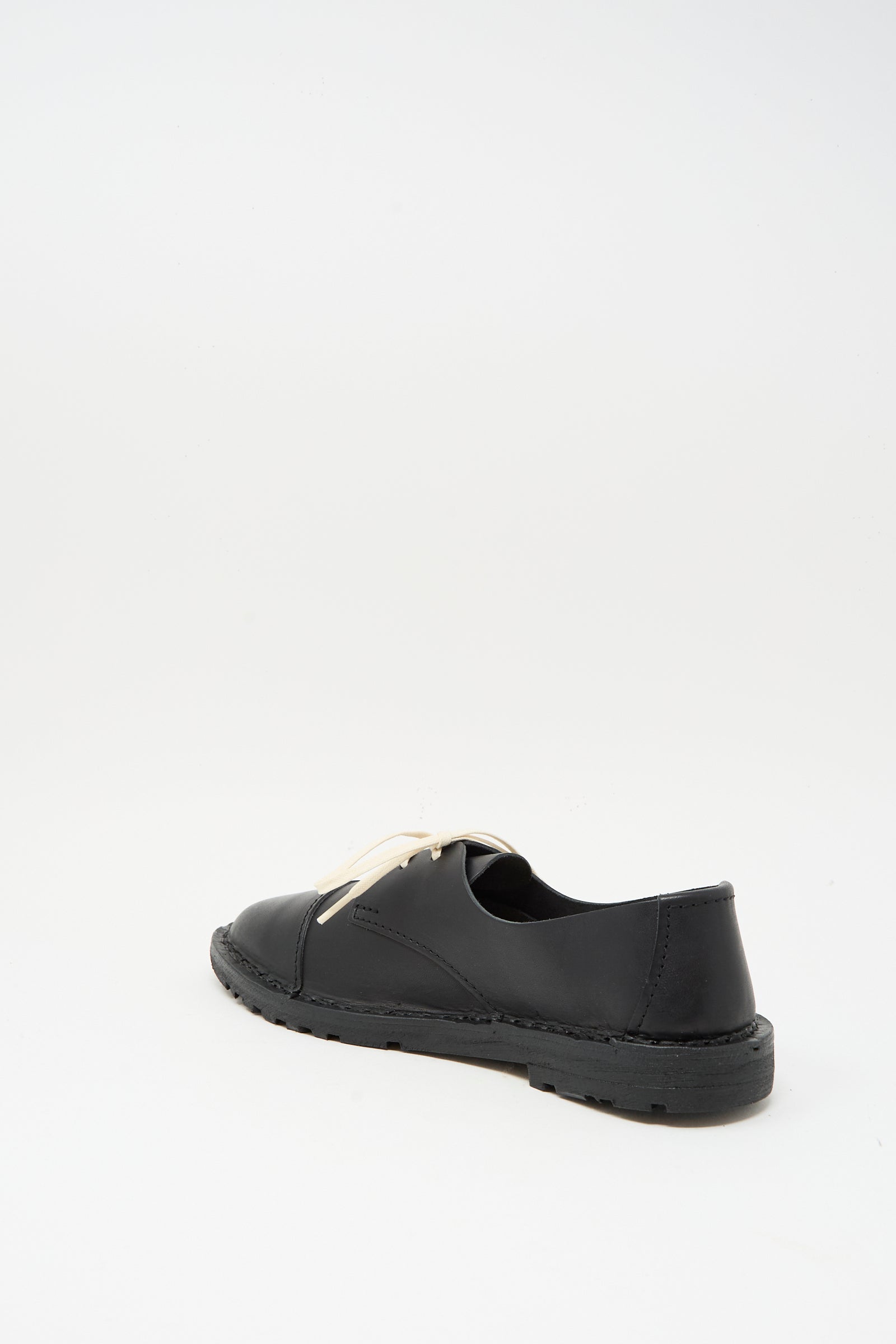 The Steve Mono Leather Oxford in Black is a vegetable-tanned leather shoe with a low heel and white laces, made in Spain, shown on a plain white background.