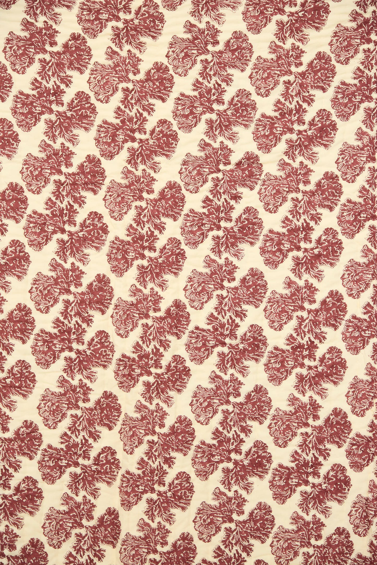 The Wild Shroom Quilt 100 x 108" by Studio Ford features cream block-printed percale cotton with a repeating red floral motif evenly distributed across the surface.