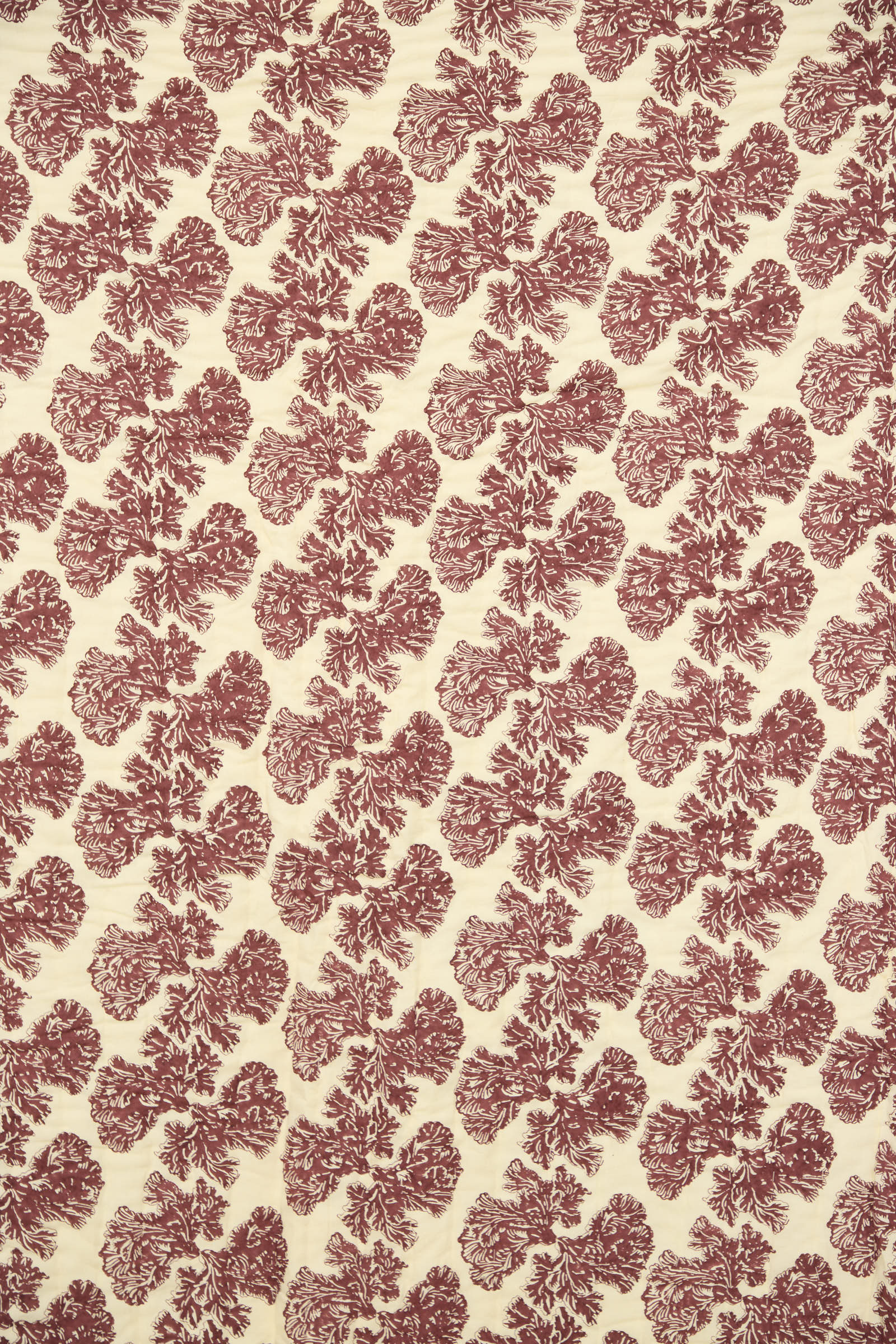 The Wild Shroom Quilt 100 x 108" by Studio Ford features cream block-printed percale cotton with a repeating red floral motif evenly distributed across the surface.